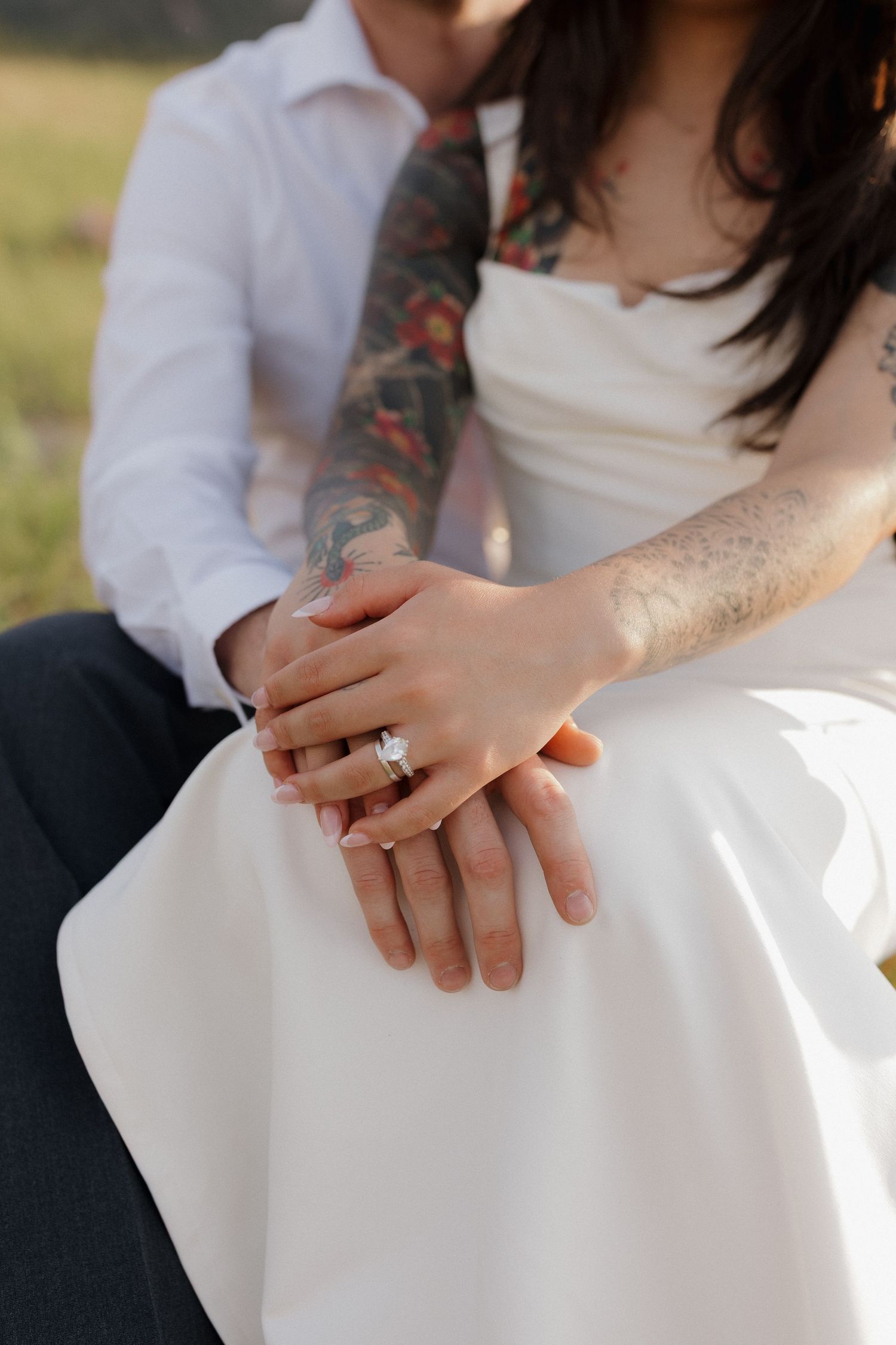 Close-up of a couple holding hands during an intimate and romantic couples photography session