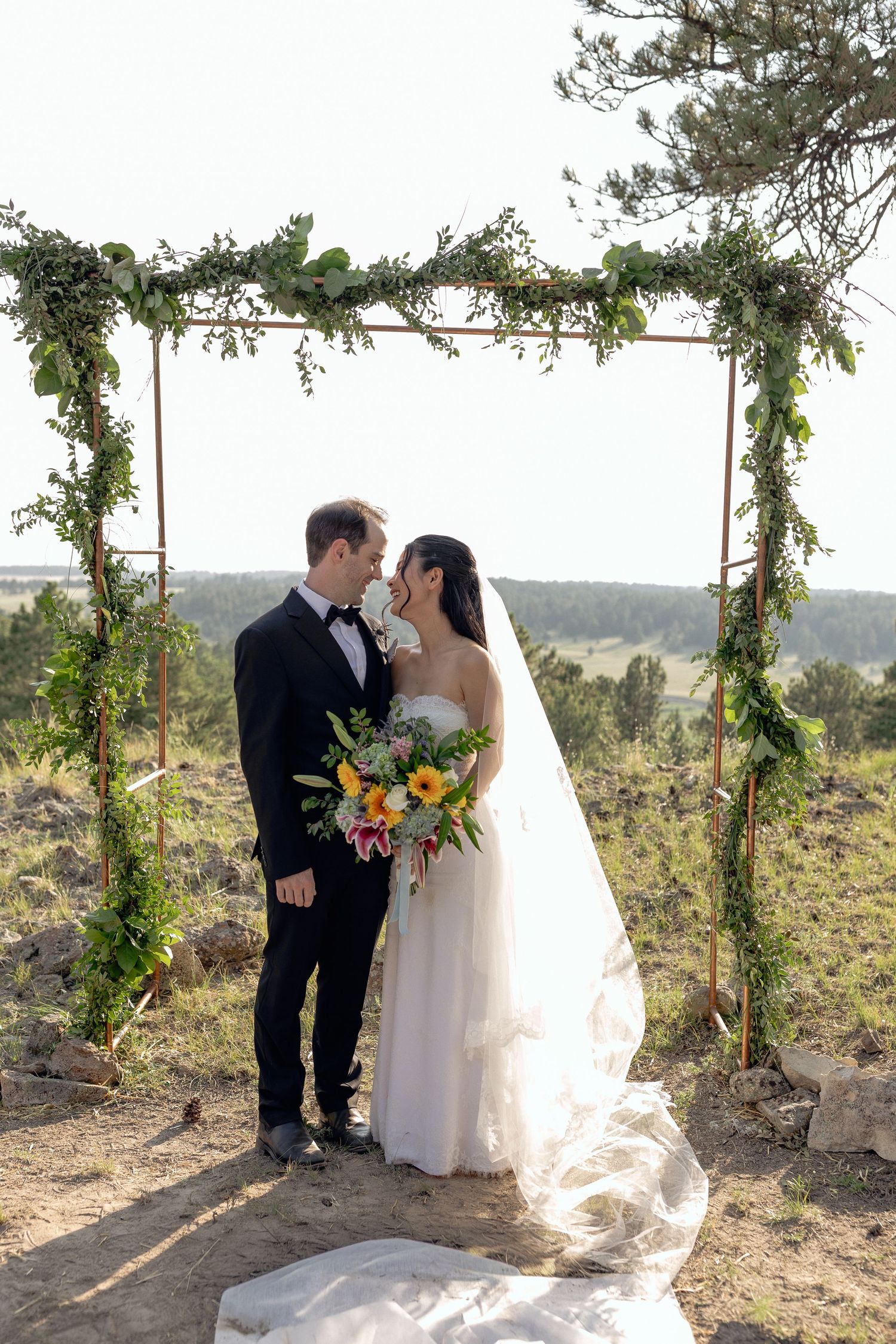 Romantic Colorado wedding ceremony and newlywed couple portraits by natalia
