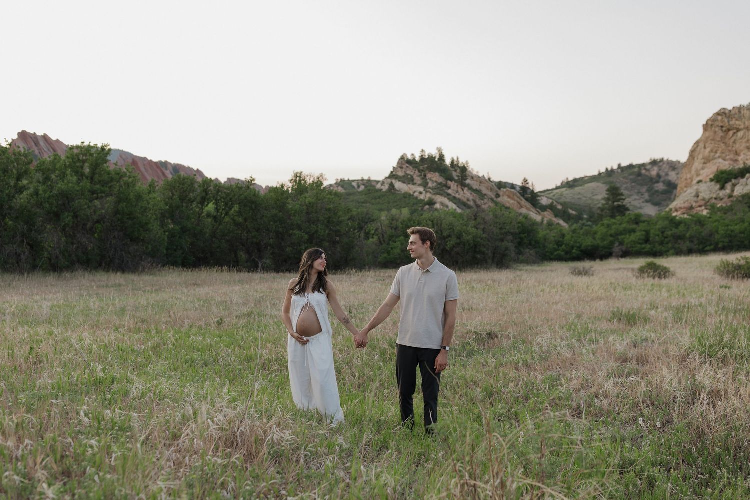 Expecting couple embracing during a warm and intimate maternity session