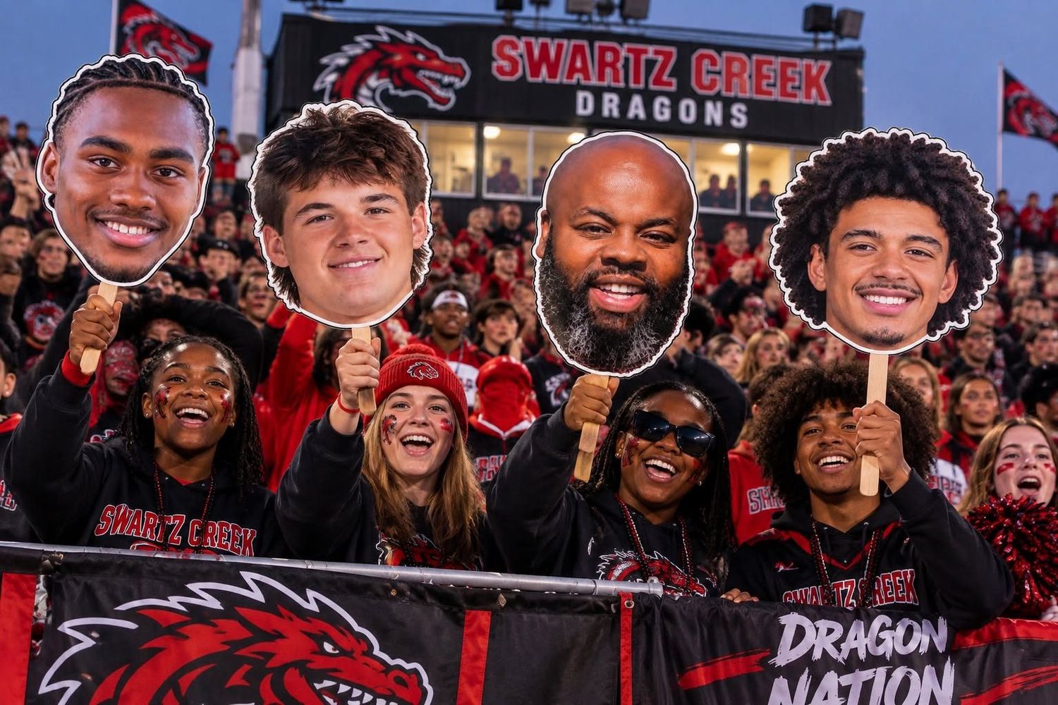 Swartz Creek Dragons student section holding custom Fathead cutouts