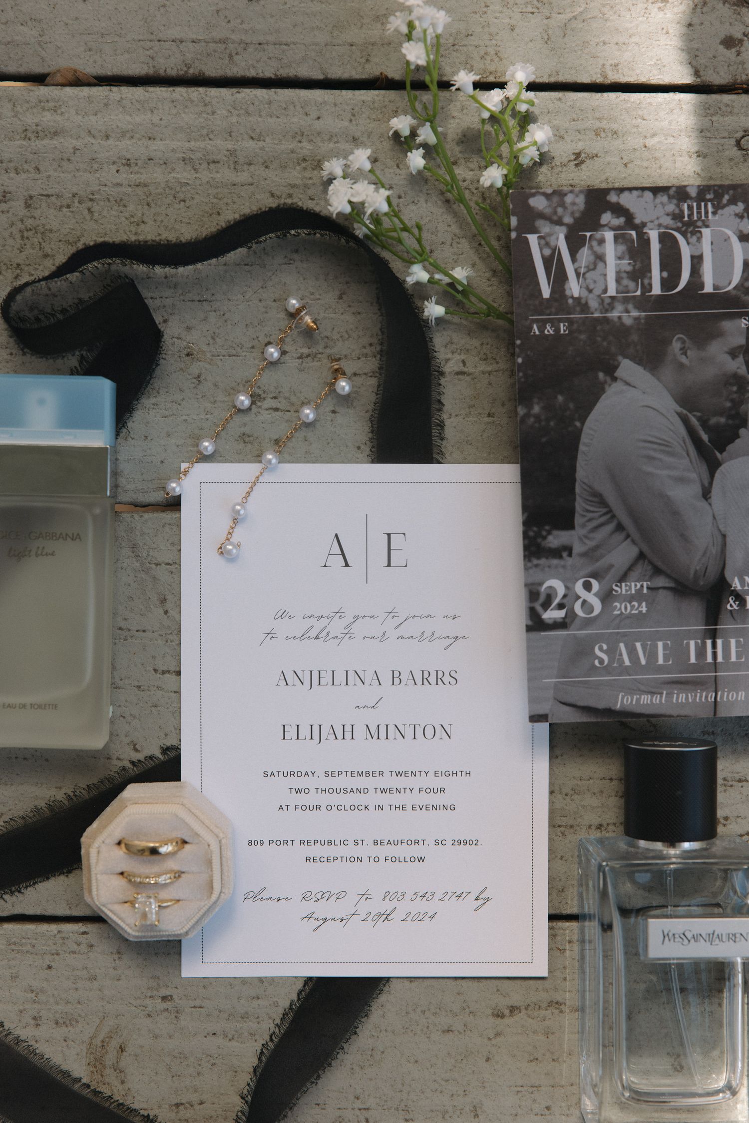 Elegant wedding invitation suite for Anjelina Barrs and Elijah Minton with rings, earrings, and save the date card.