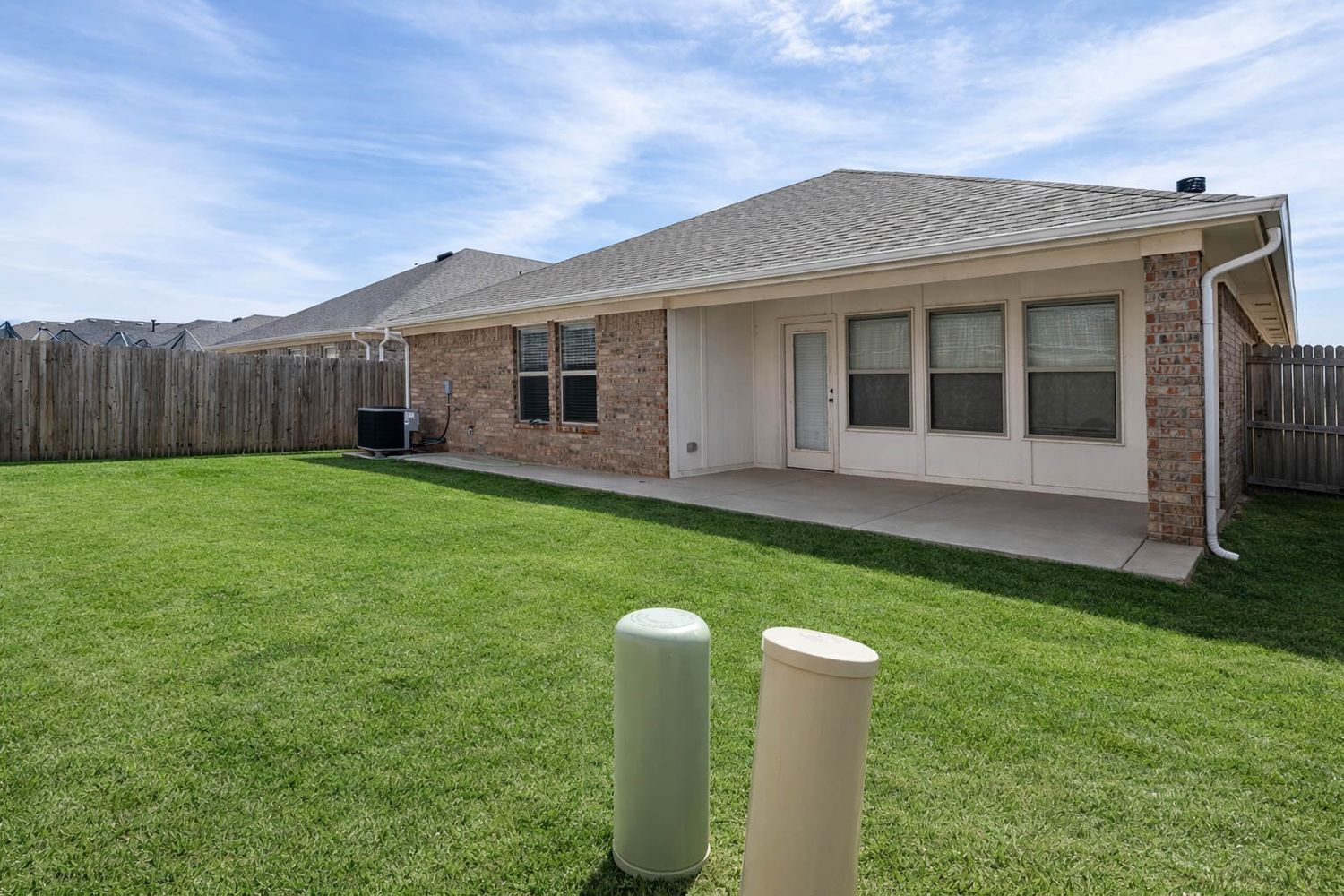 Backyard Exterior Real Estate Photo with Lawn Space in Oklahoma City