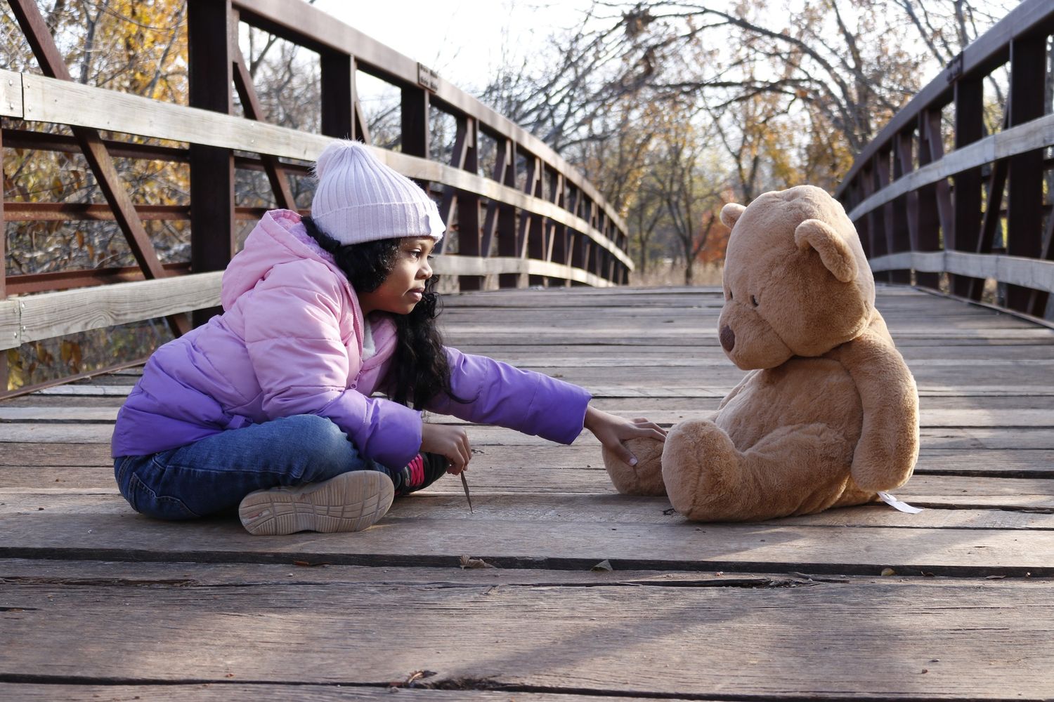 Outdoor Child Portrait with Teddy Bear on Bridge in Oklahoma City