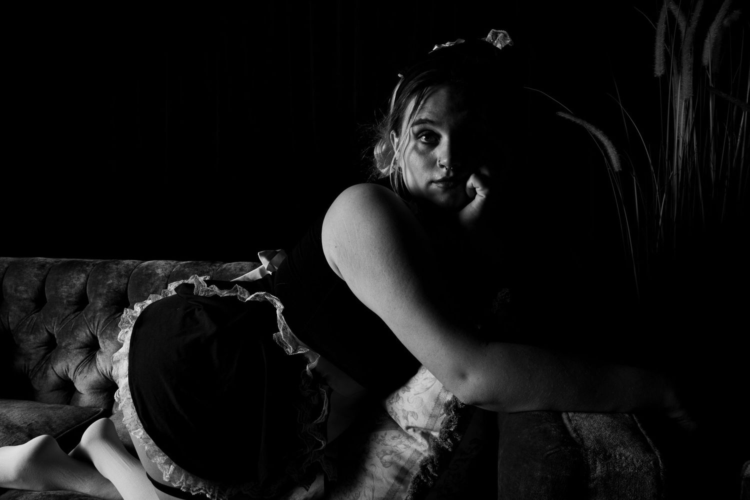 Artistic black and white boudoir photography series showing intimate shadows and silhouettes.