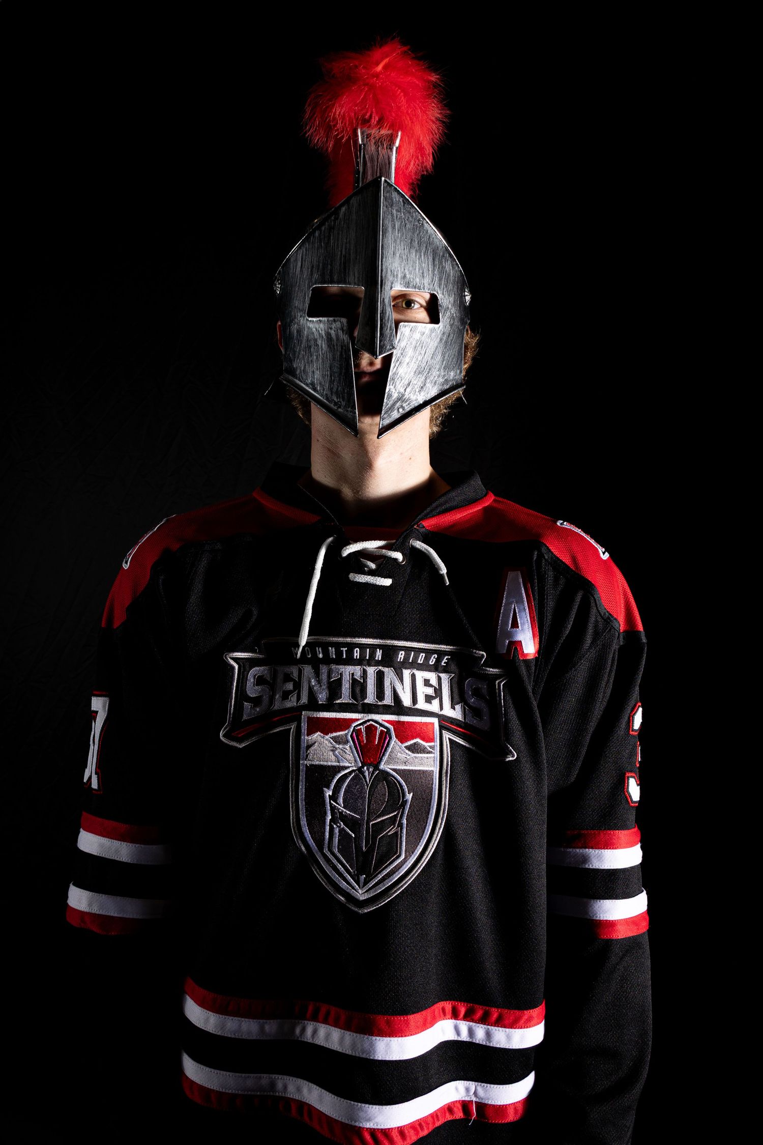 A series of dramatic black and red sports jersey photos showing the Sentinel team uniform with metallic helmet details.