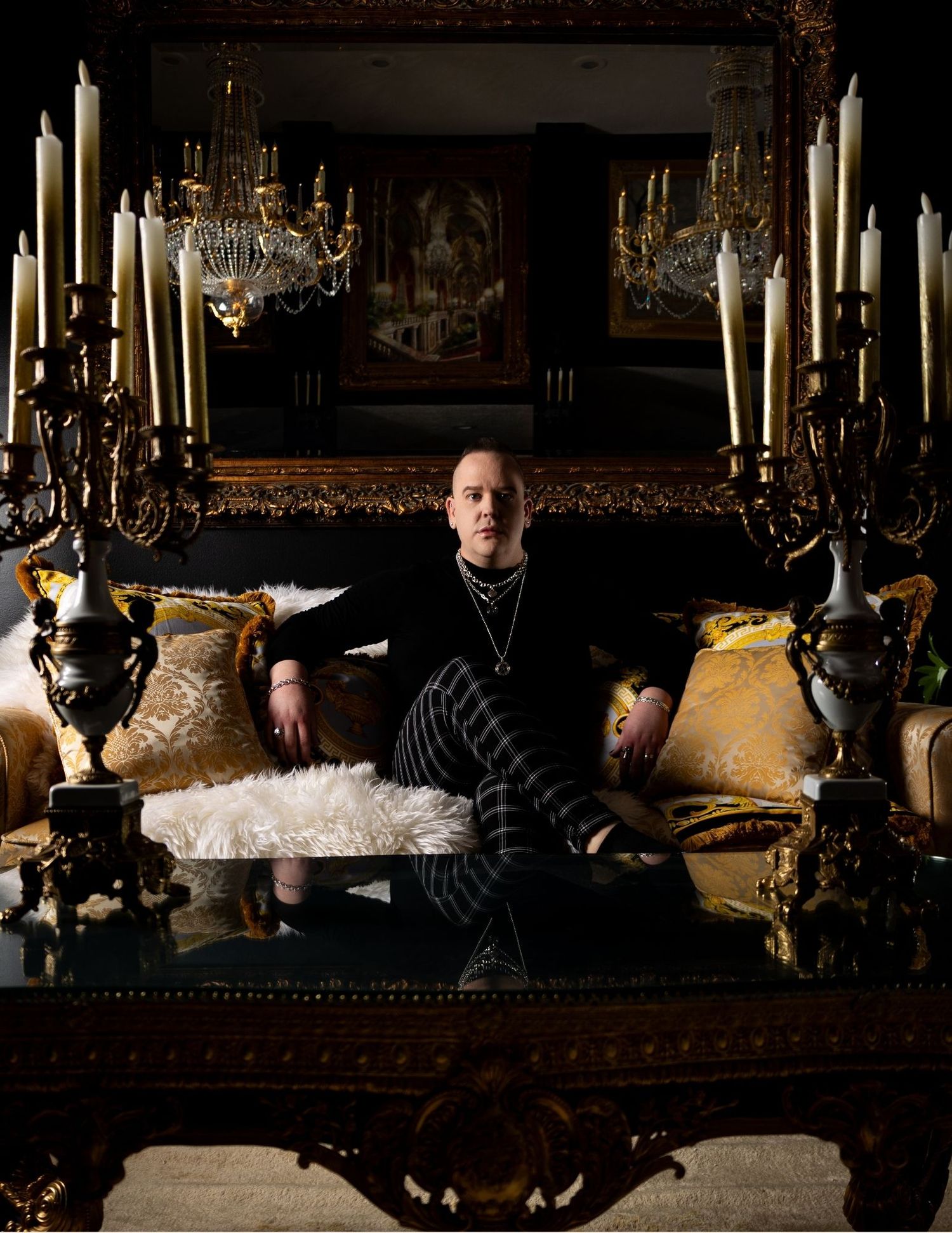 Four connected images show a dark atmospheric scene with someone seated on an ornate couch in a dimly lit vintage room.