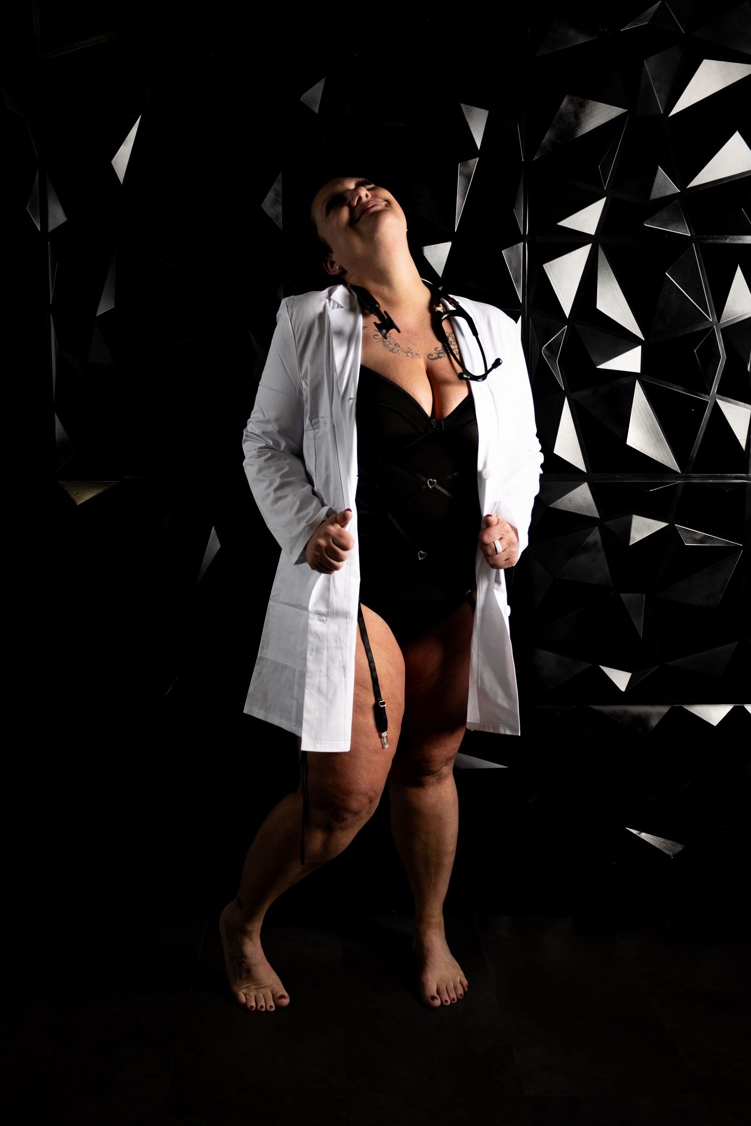 Artistic portrait series featuring white coat against geometric black and white background.