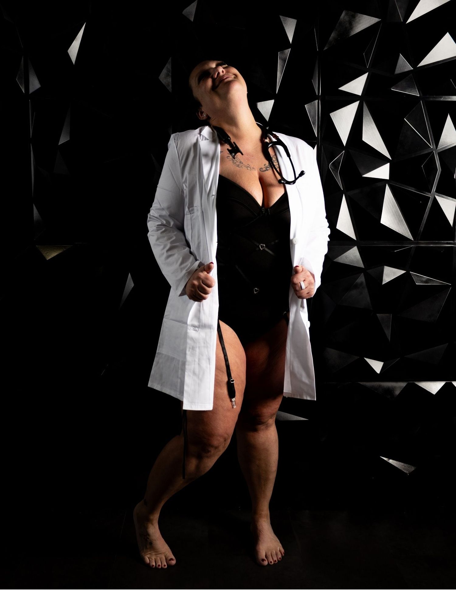 Artistic black and white photography with geometric shapes and dramatic lighting.
