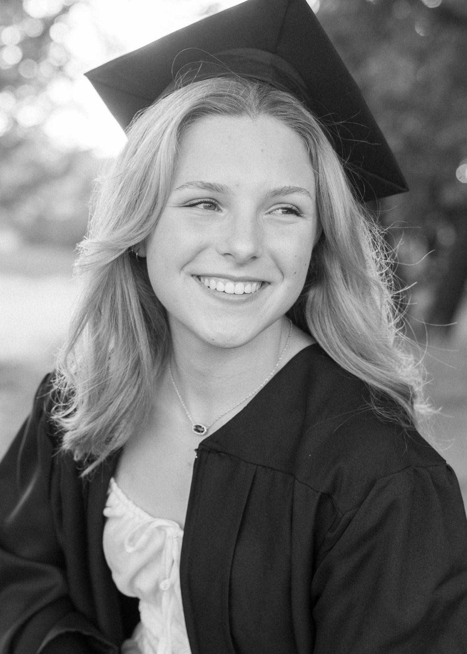 Confident high school senior smiling during outdoor session in Fort Worth Texas