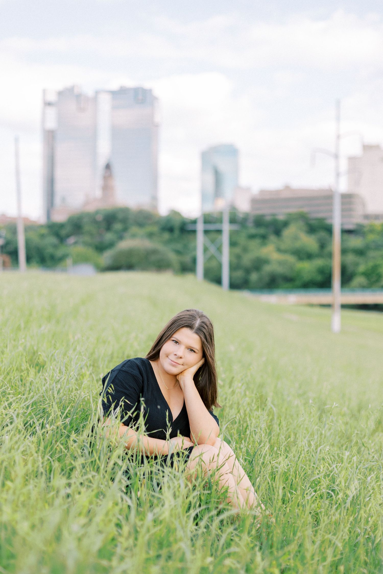 fort worth skyline senior session Confident high school senior smiling during outdoor session in Fort Worth Texas