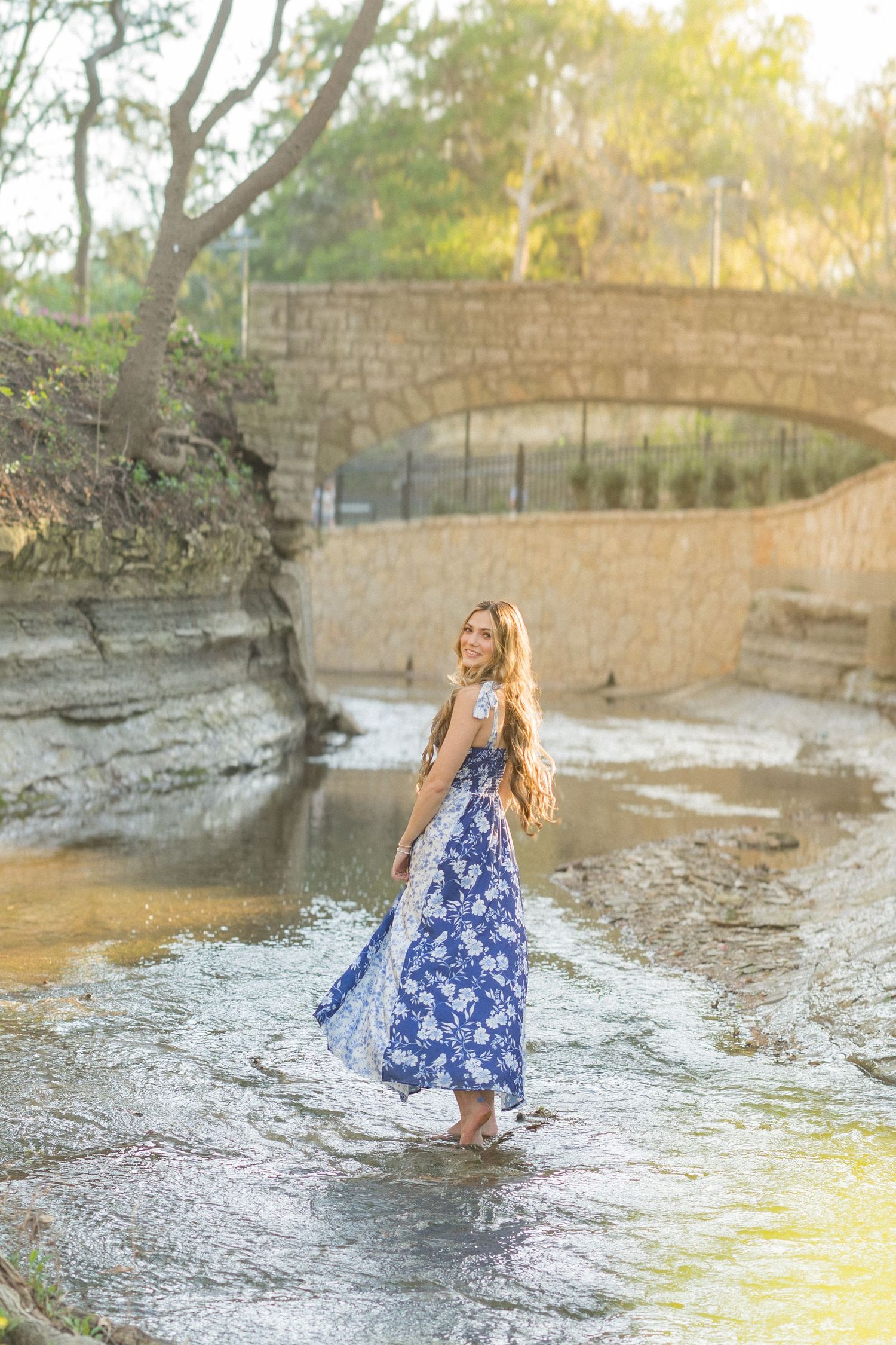 Candid senior photo laughing in golden hour light Dallas Fort Worth photographer