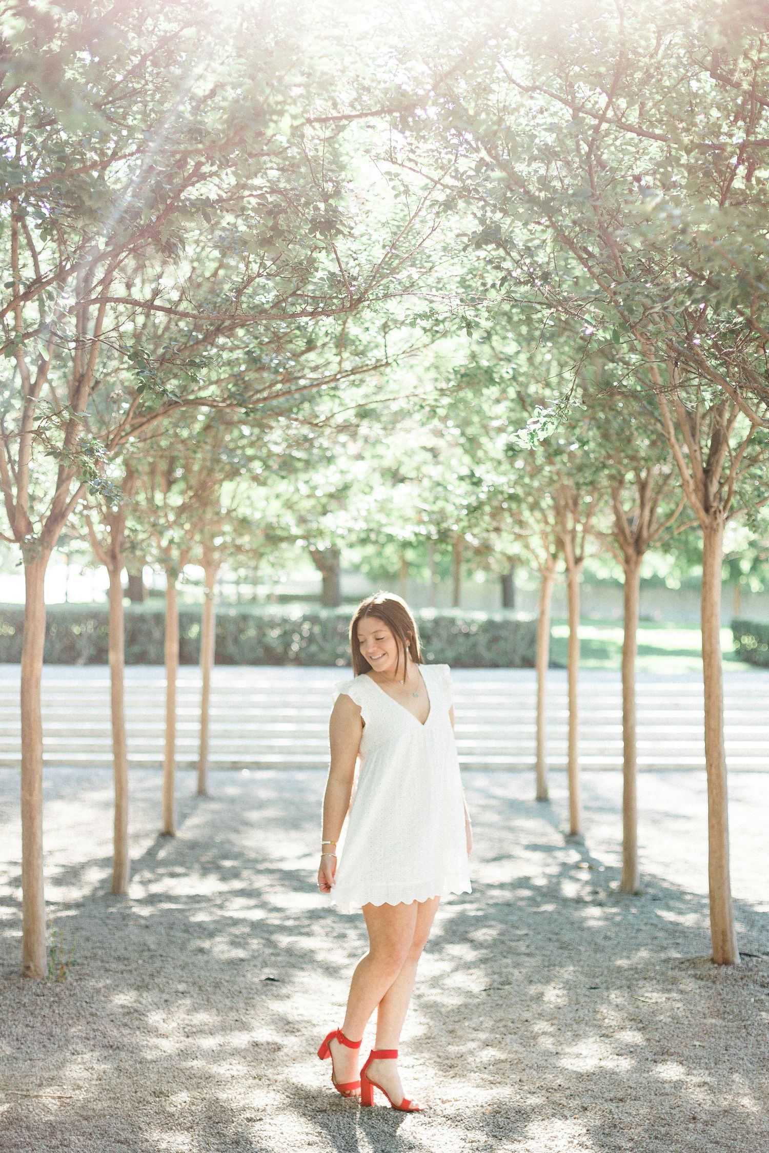 Stylish senior portrait with outfit inspiration and natural posing Texas Senior portraits in downtown Fort Worth with urban textures and nat