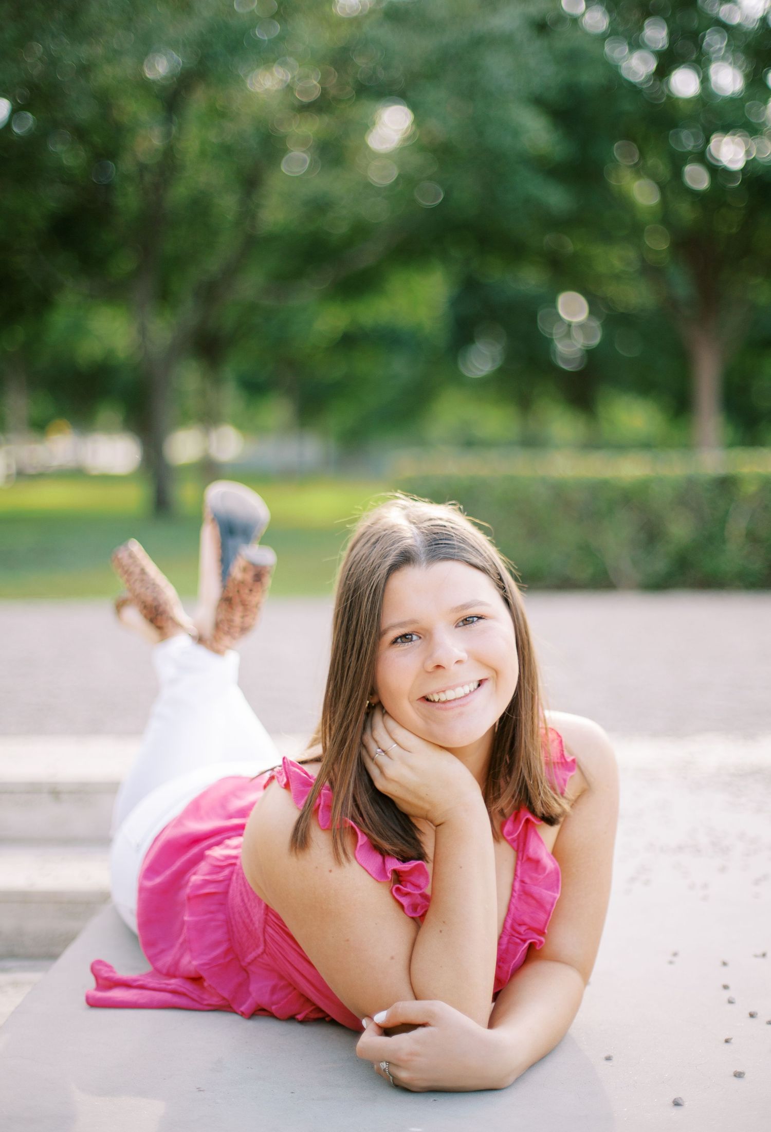 Senior portraits in downtown Fort Worth with urban textures and natural posing cap and gown at Kimbell art museum senior session.