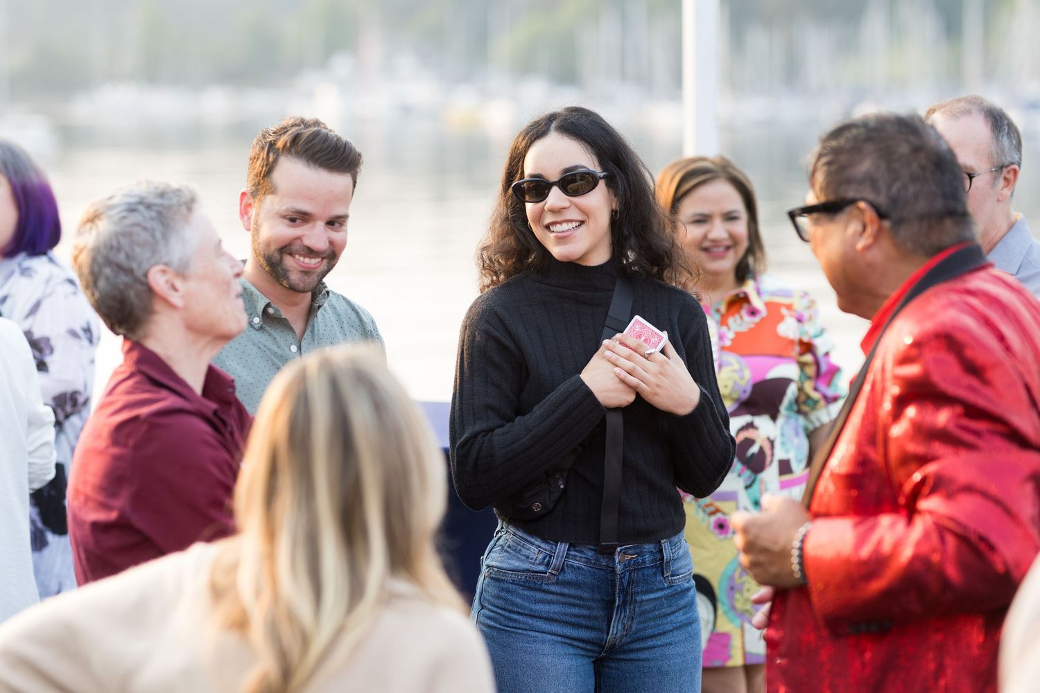 Group of professionals networking outdoors on a luxury Yacht during a casual daytime business event.