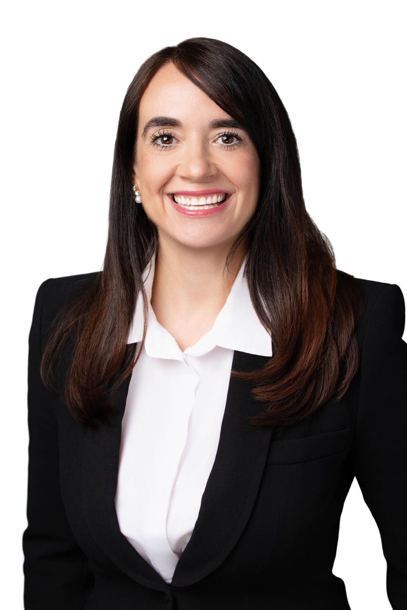 Professional woman in black blazer and white blouse smiling confidently against white background.