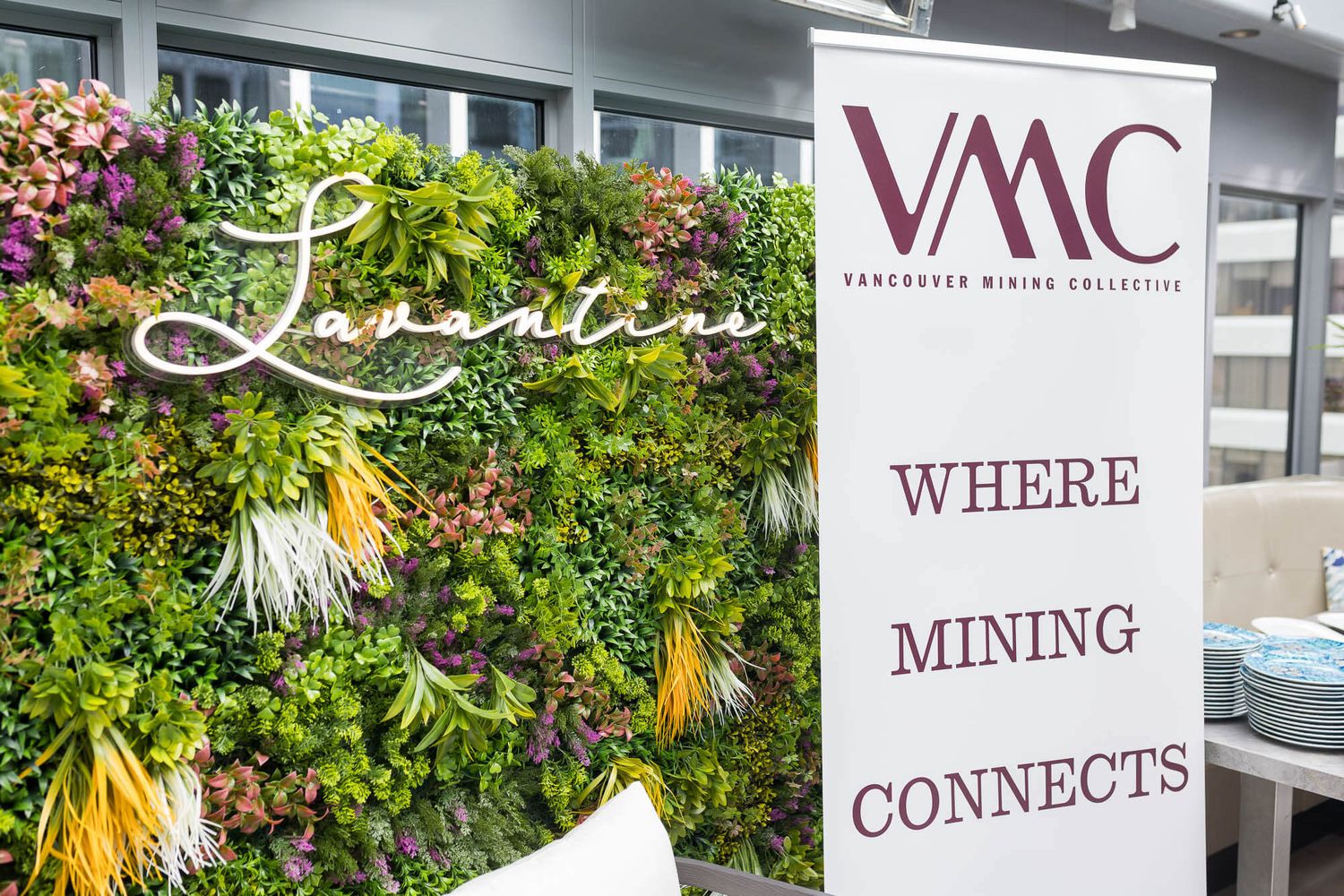 Vancouver Mining Collective VMC event with green living plant wall backdrop.
