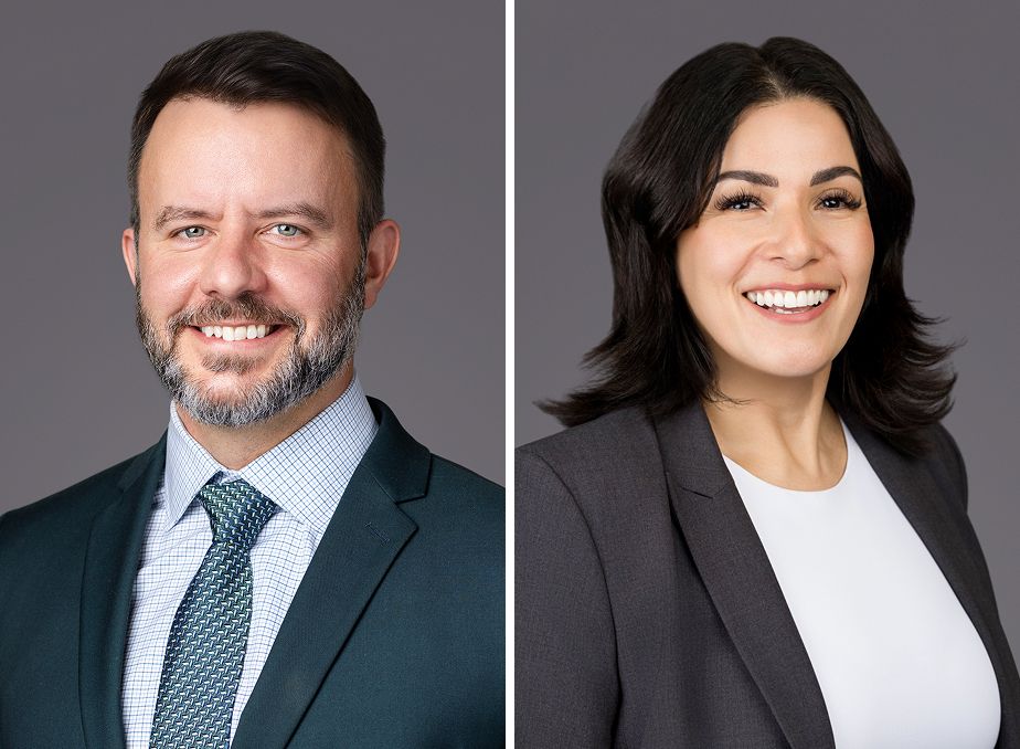 Two professional headshots side by side, a man in a navy suit with tie and a woman in a dark blazer, both smiling.