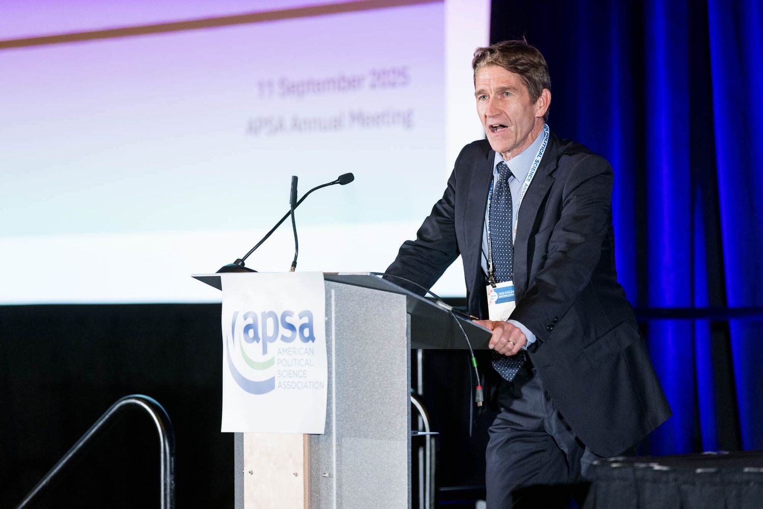 Speaker at RAPSA Annual Meeting podium, September 11 2025, delivering presentation at professional conference.