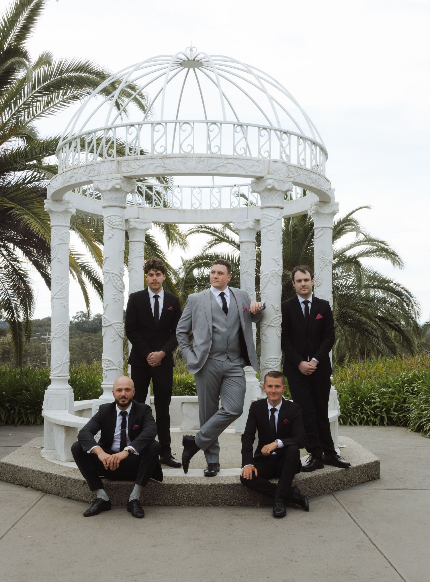 Documentary-style wedding photograph of groomsmen