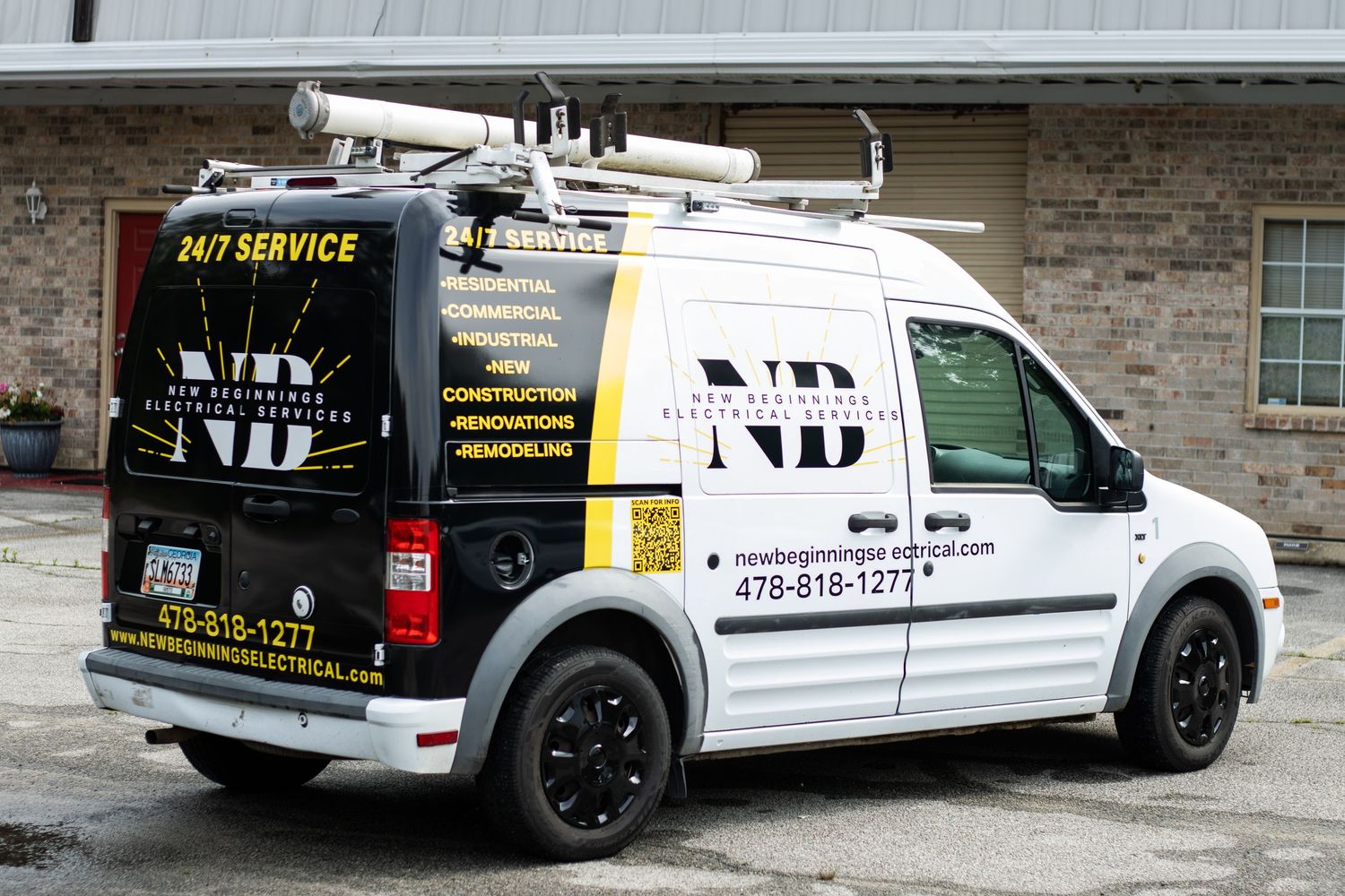 NB Electrical Services van with 24/7 service branding, ladder rack, and contact number 478-818-1277 parked outside.