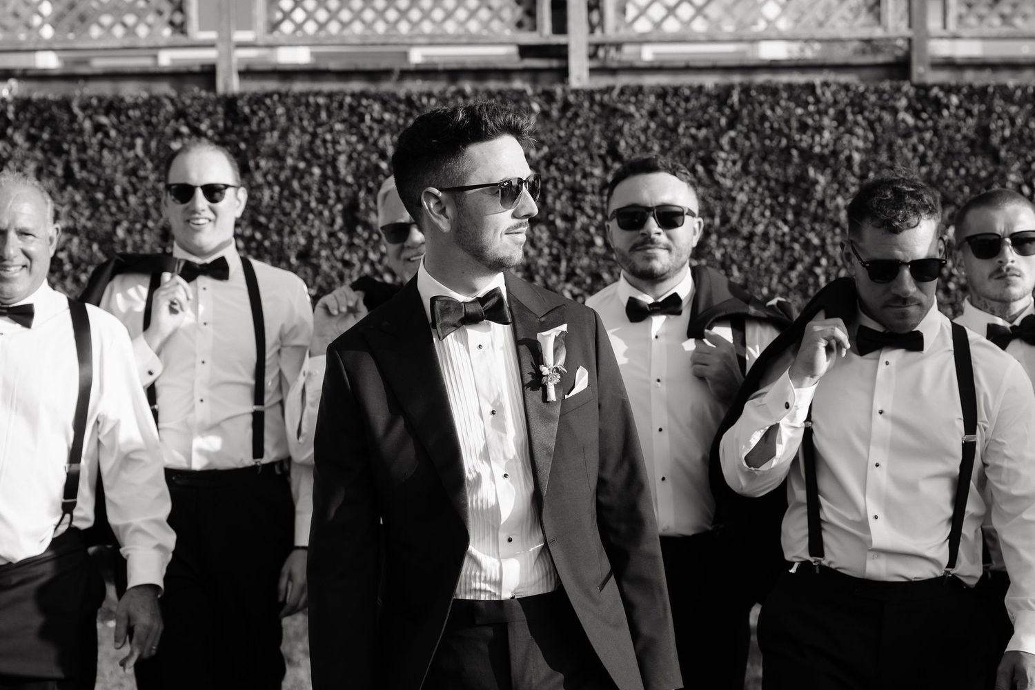 A black and white photo collage showing people in formal attire at what appears to be a wedding or formal event.
