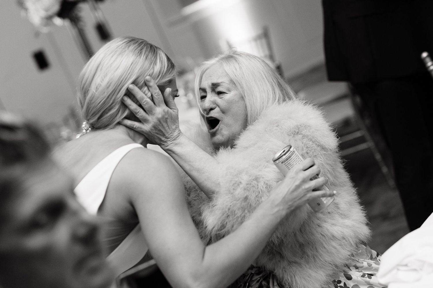 Intimate black and white dance photos capturing tender moments at a wedding reception.