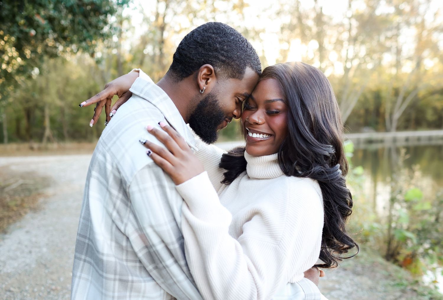 Husband and wife sharing an intimate moment during an anniversary session at McAlpine Park.