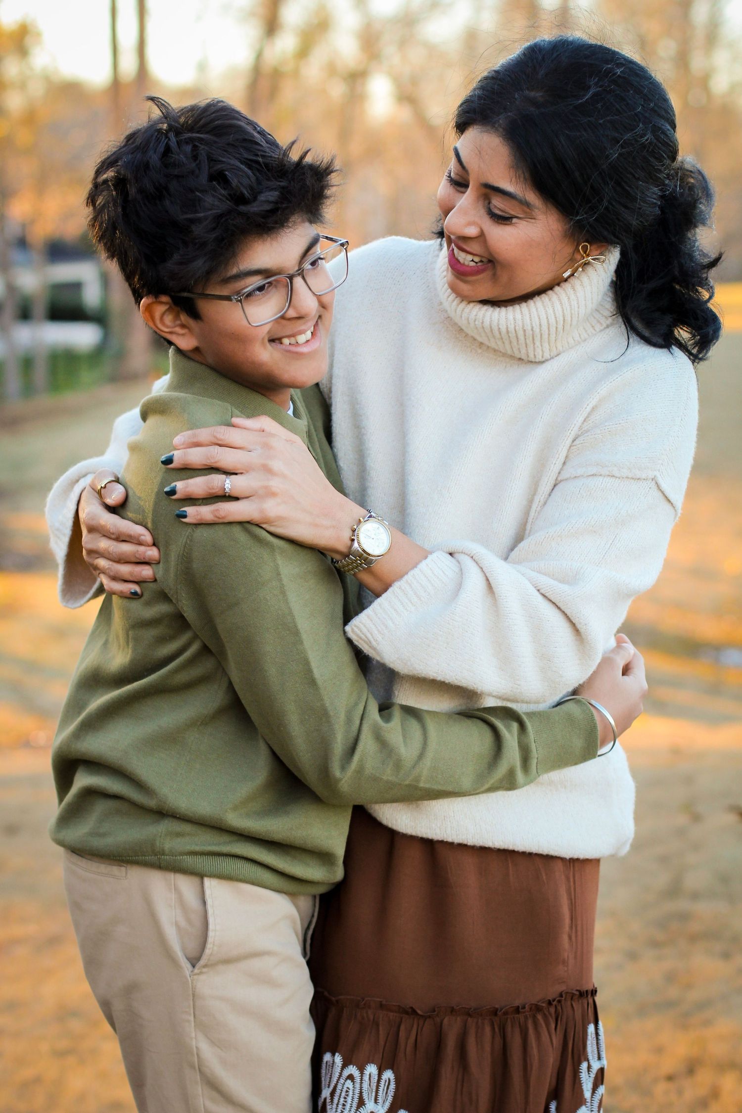 Mother and teenage son laughing and hugging during a session in Indian Trail, NC.