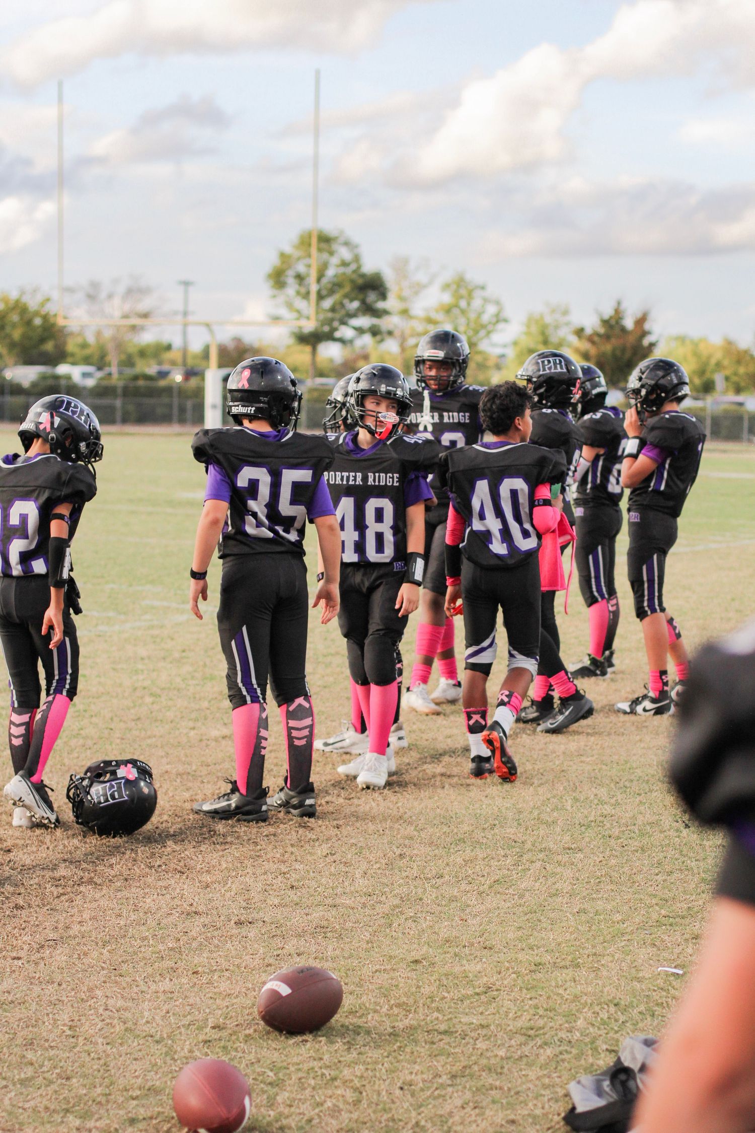 High school football players gathered on the sidelines during a game at Piedmont High.