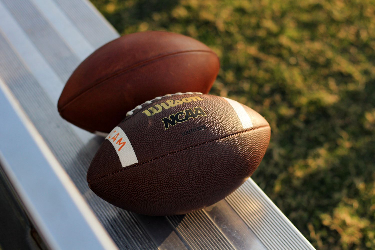 Detail shot of footballs on the bench at Weddington Middle School.