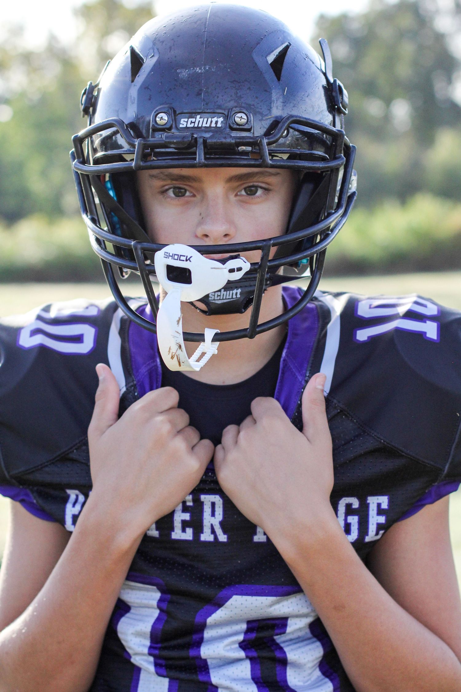 Football player posing for a professional sports portrait at Porter Ridge Middle School.
