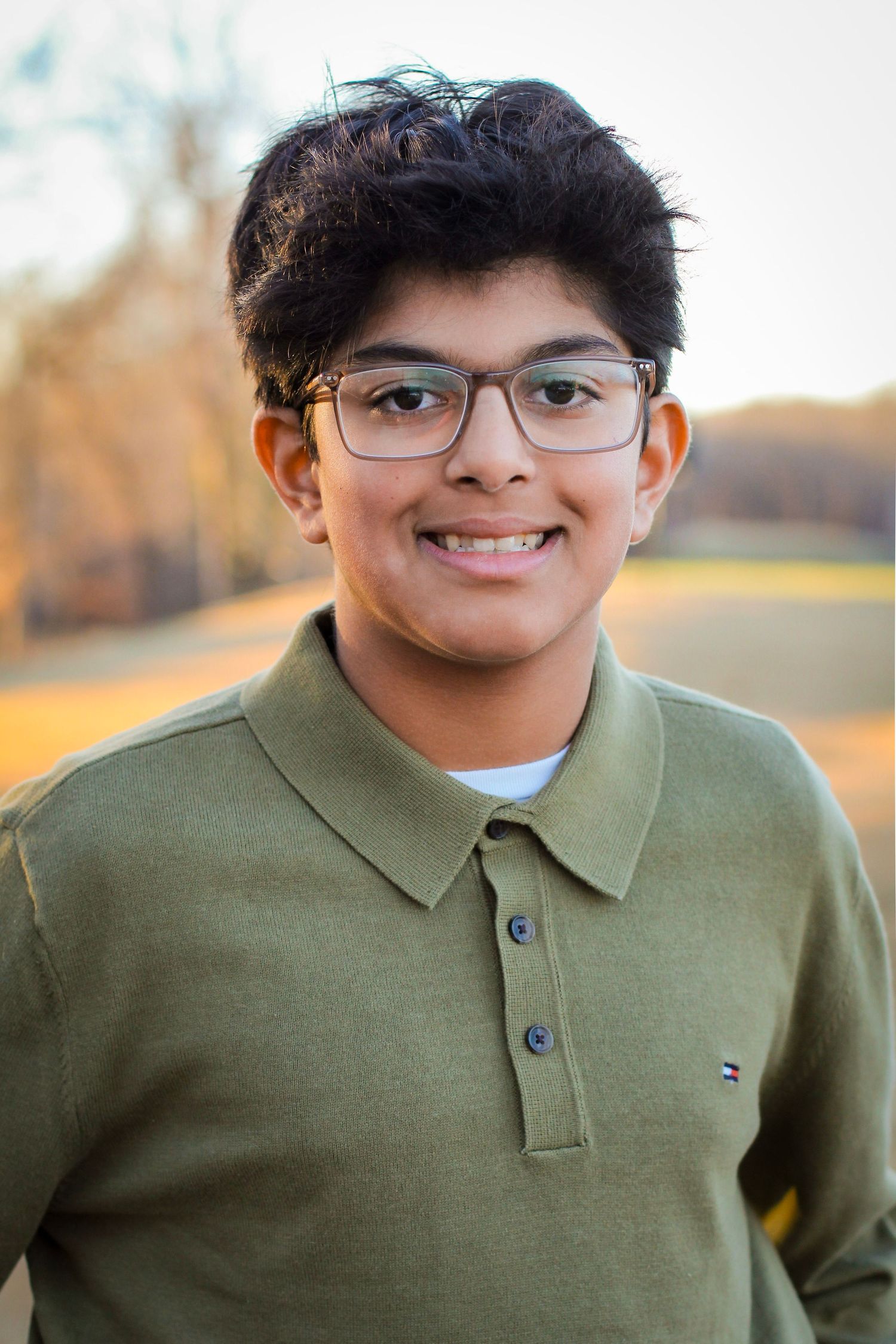 8th grade boy posing for his middle school graduation portraits in Charlotte, NC.