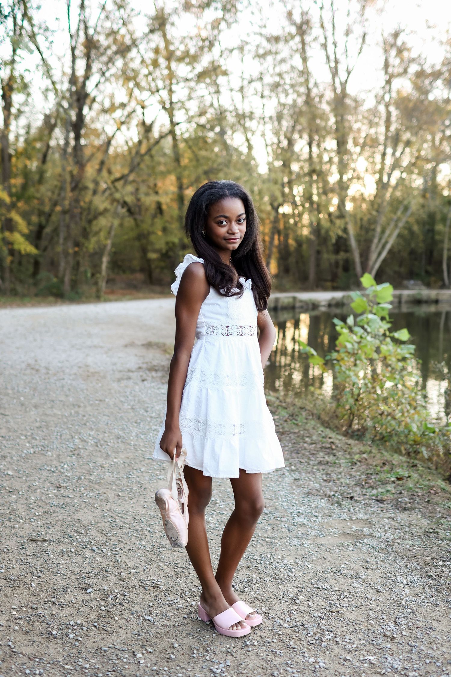 8th grade girl posing with her ballet shoes for a middle school milestone portrait in Indian Trail, NC.