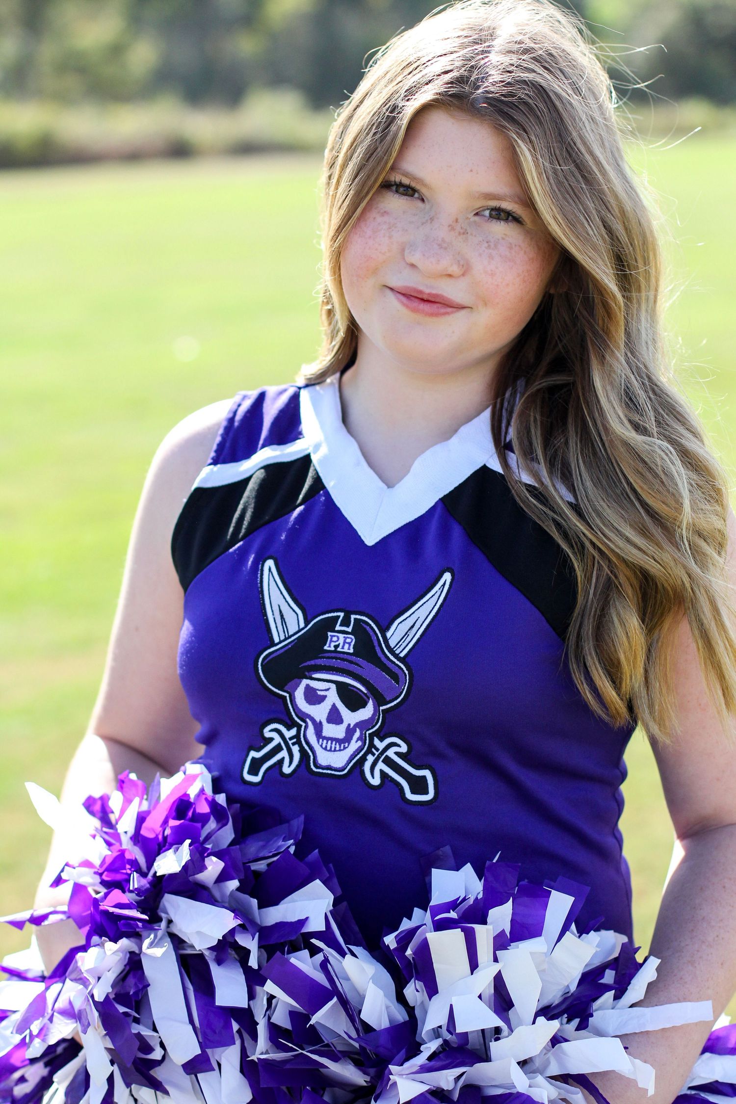 Cheerleader posing for a professional portrait at Mint Hill Middle School.