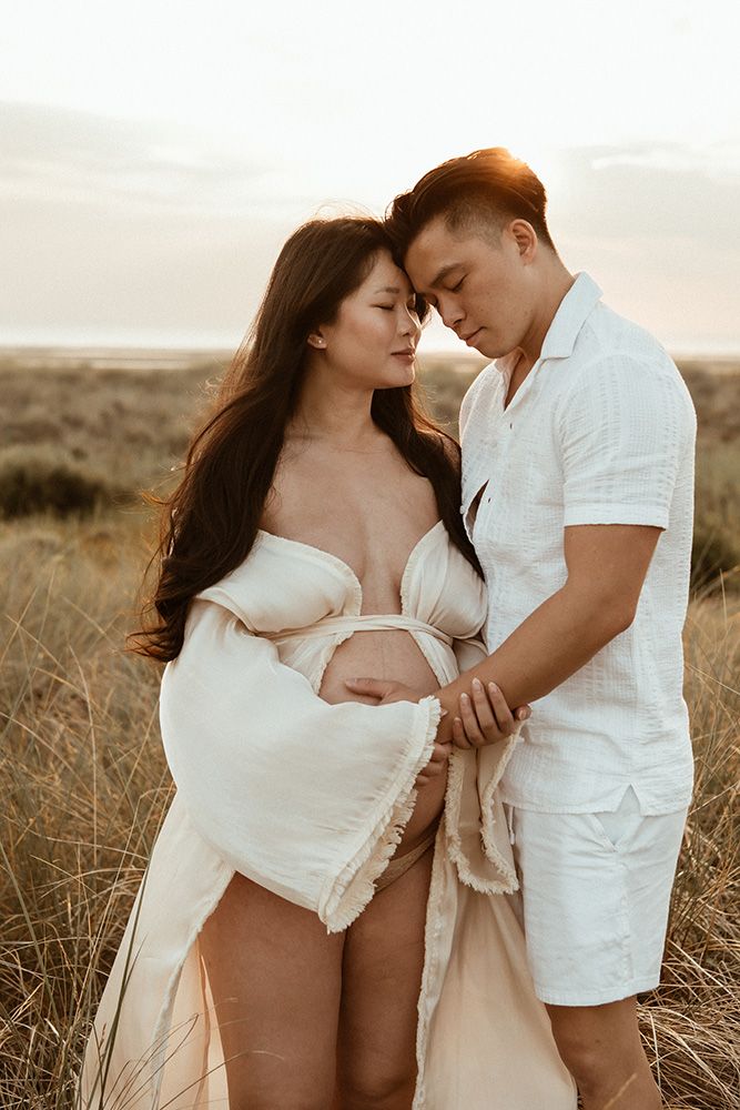 Outdoors couple maternity photoshoot in Manchester during sunset