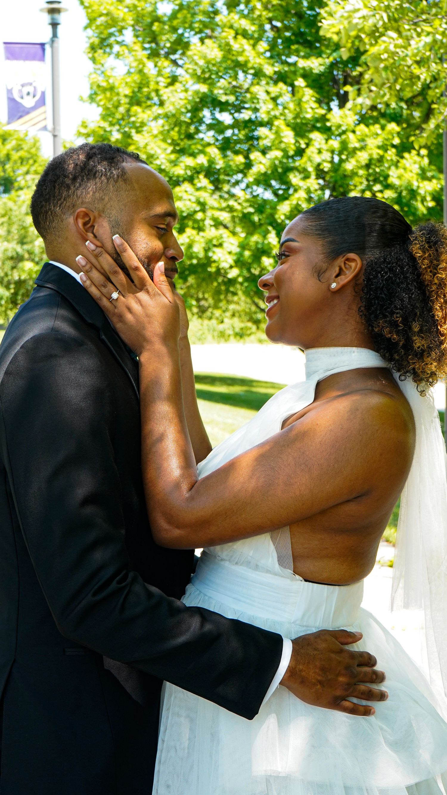 A romantic wedding kiss sequence showing tender moments between newlyweds in a garden setting.
