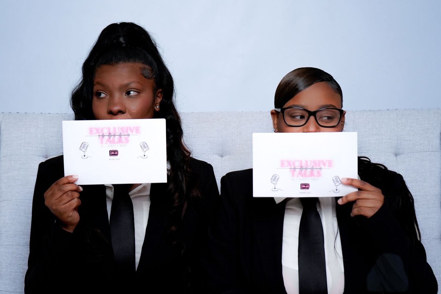 Group photo series showing people holding up white signs against blue background.