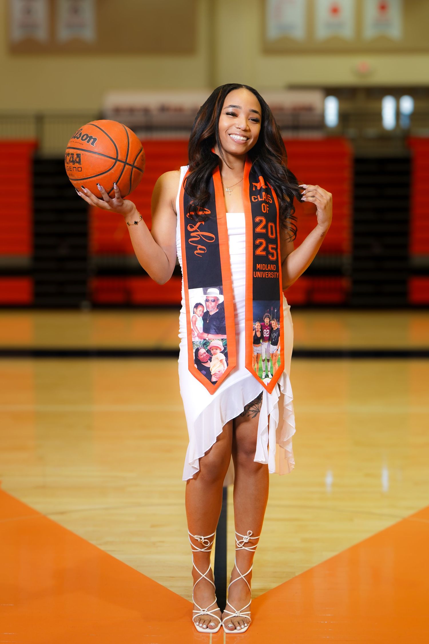 Basketball-themed graduation photos on orange court with decorative sashes.