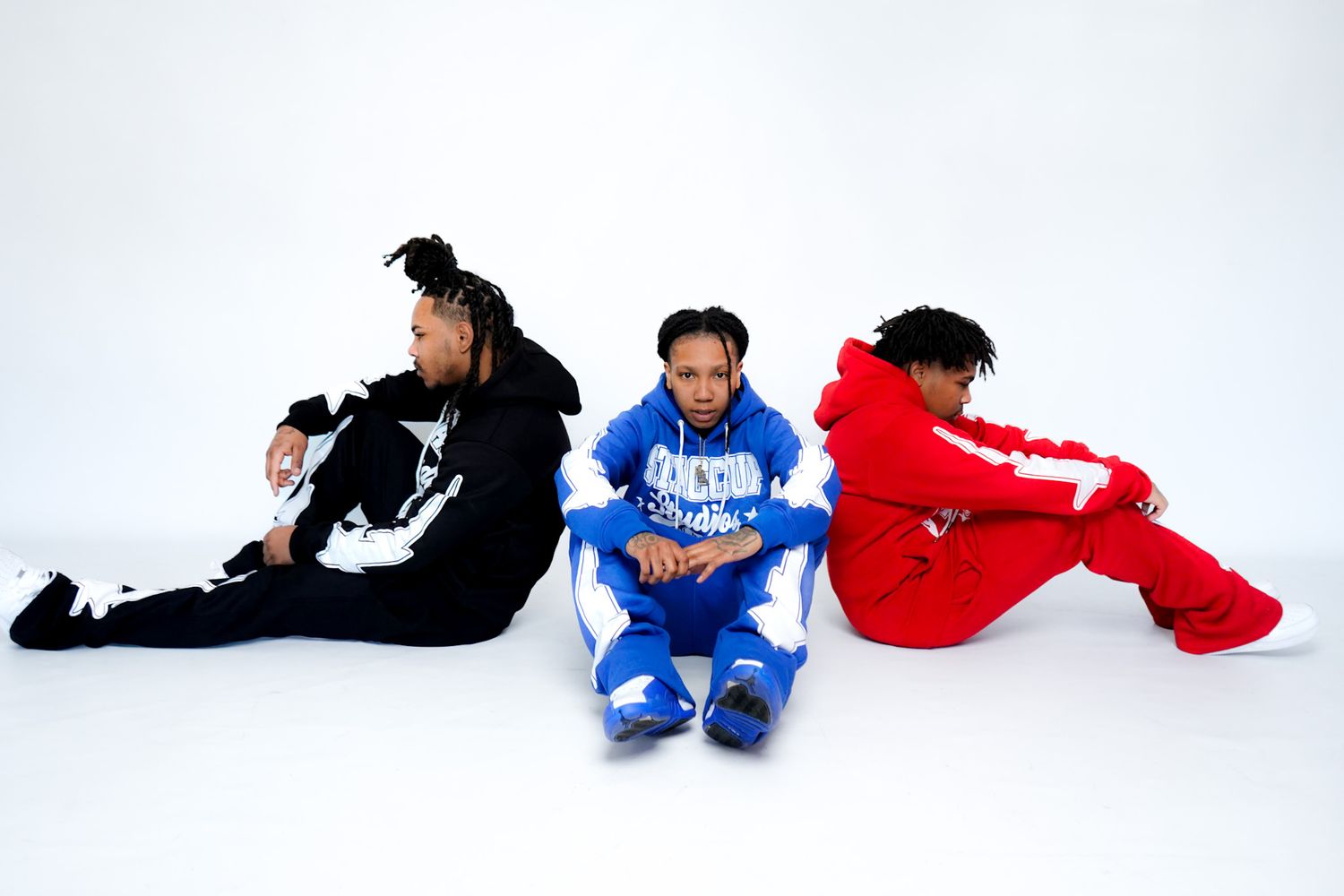 Streetwear hoodies laid flat on white background in sequence.