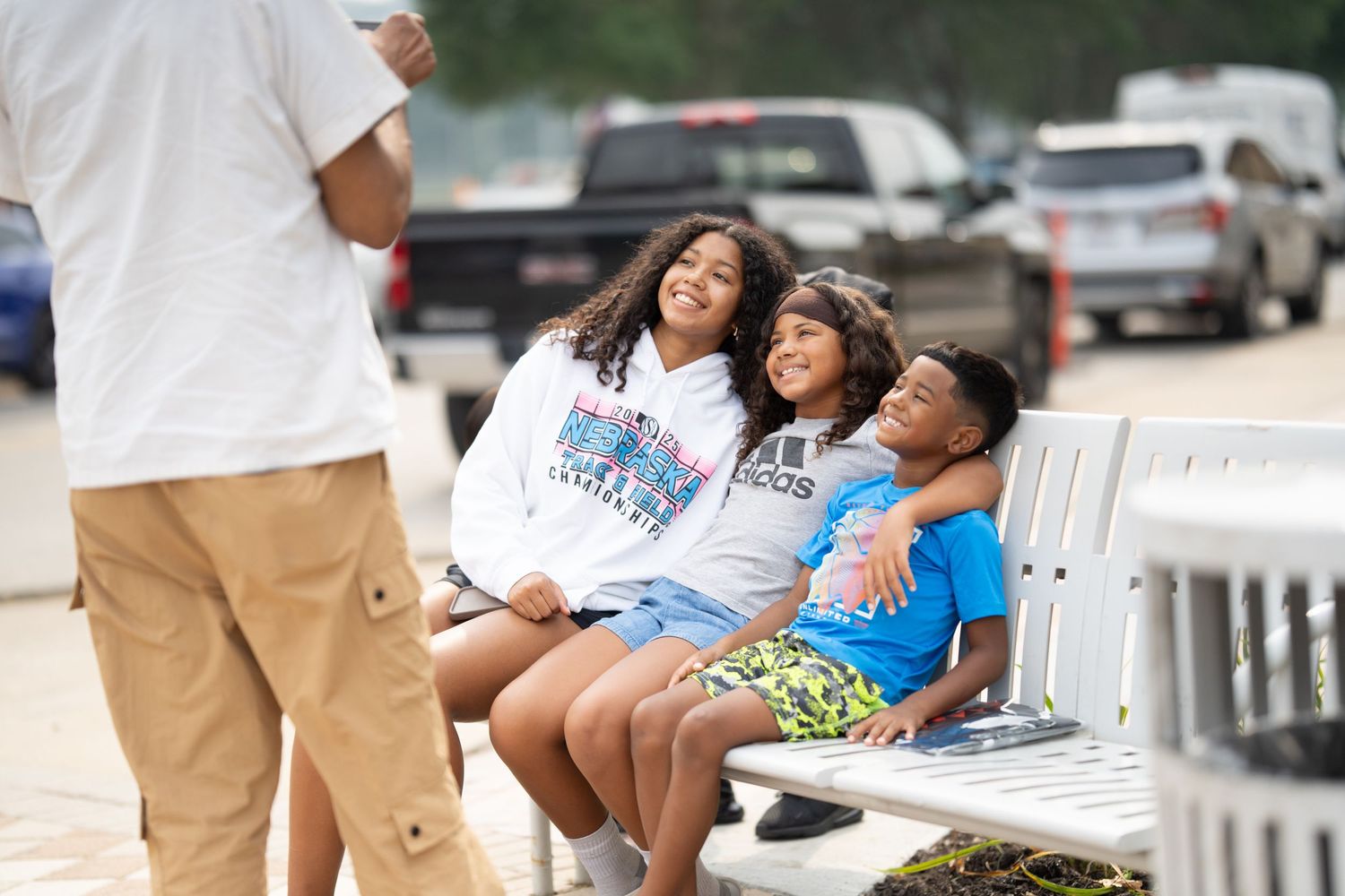 People enjoying an outdoor gathering with seating and casual attire.