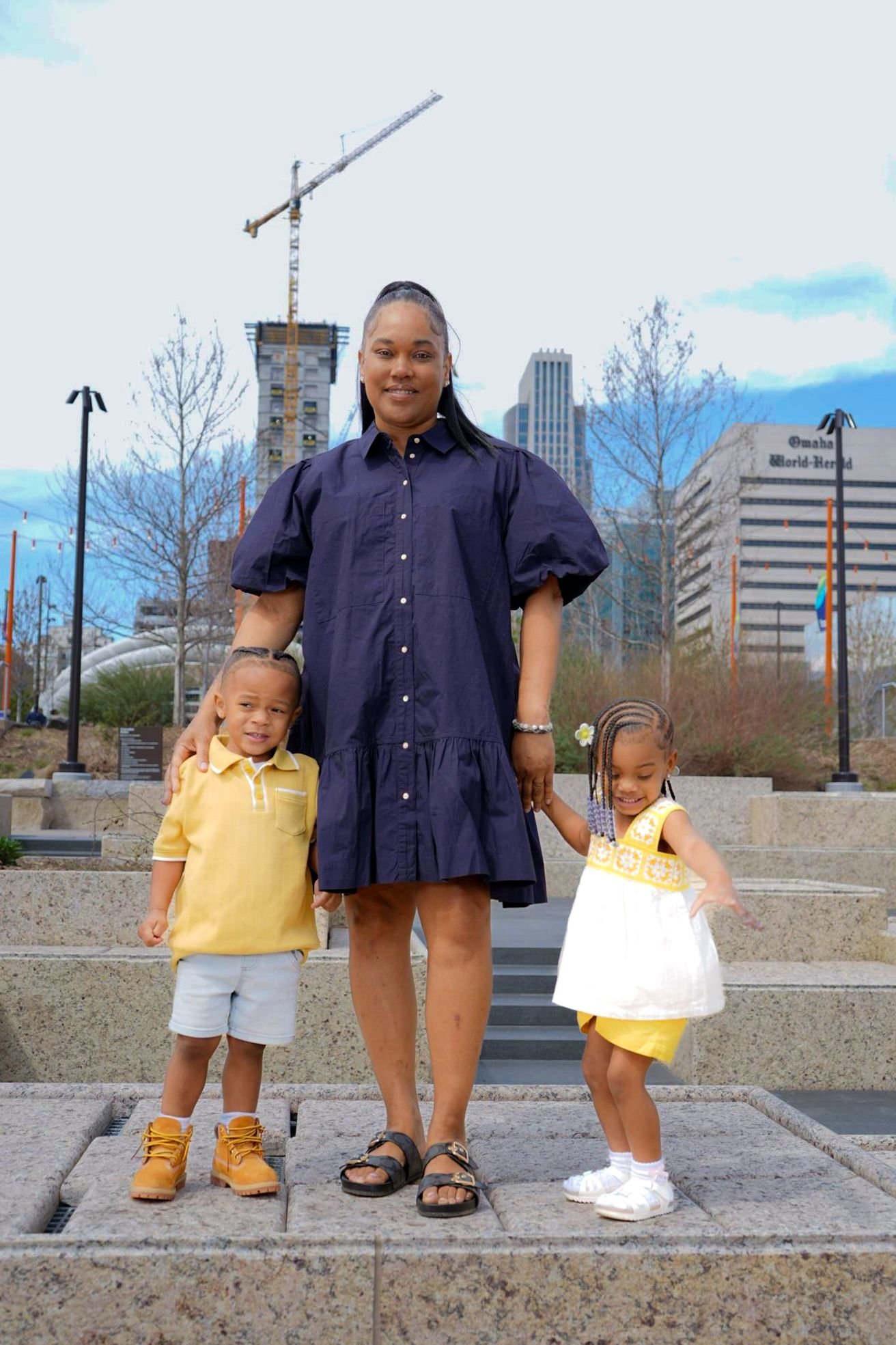 A sequence of four similar photos showing a parent and two children standing together on a concrete surface.