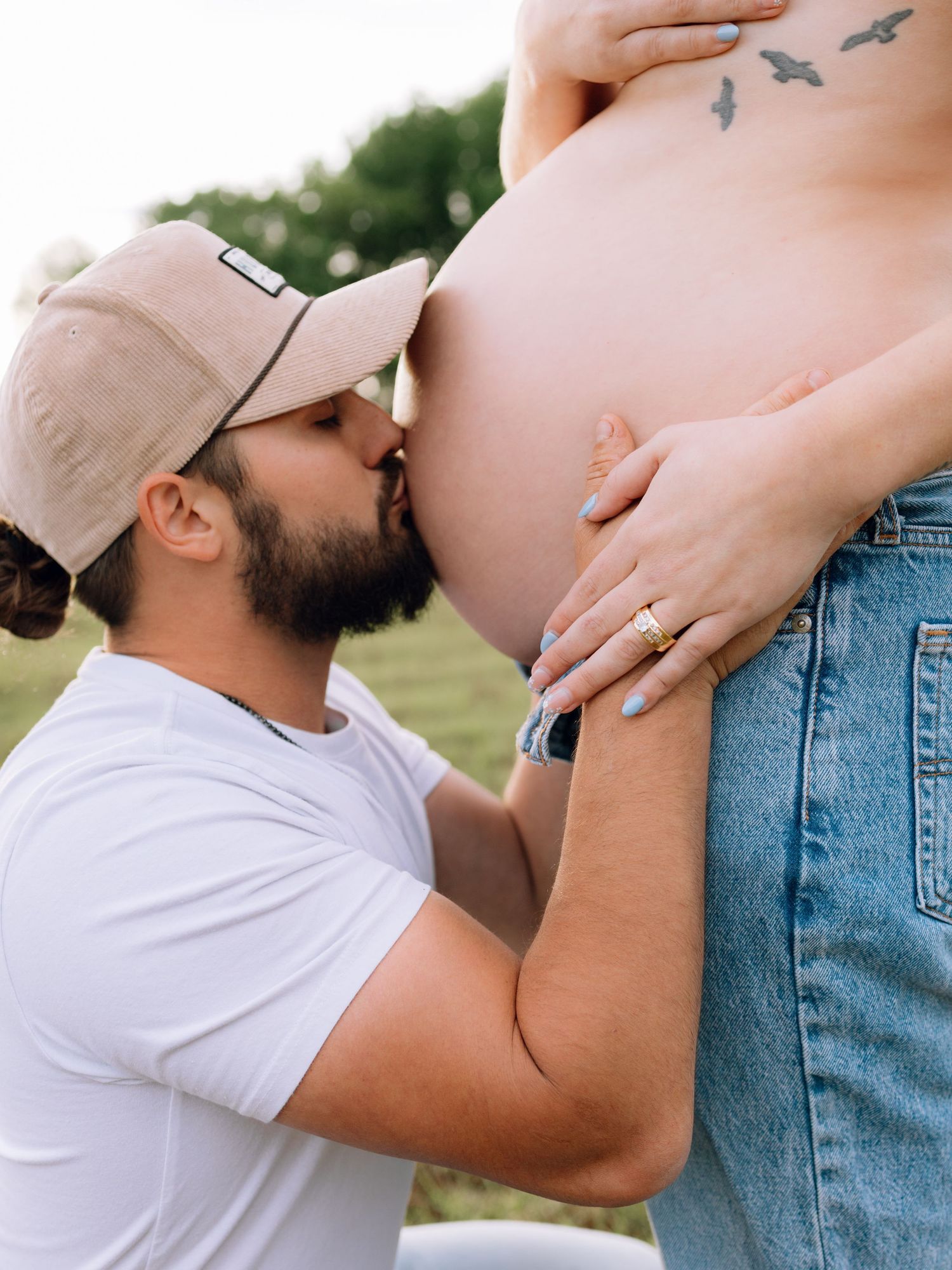 Edmond, OK maternity session in field at golden hour with flower shirt by Taylor Maze, Edmond & OKC photographer, natural light portraits.