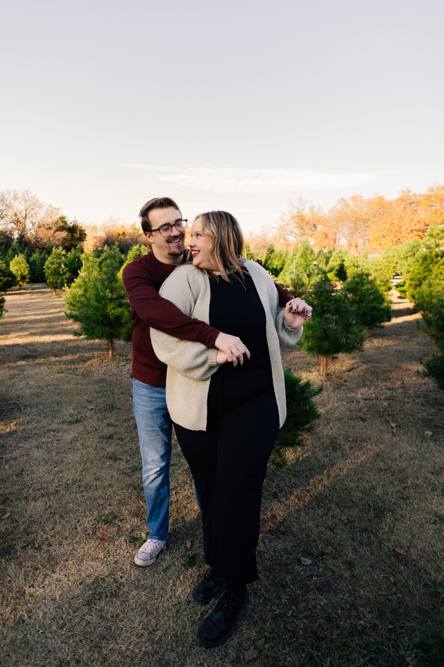 Norman, OK couples photoshoot at Christmas tree farm by Edmond & OKC photographer Taylor Maze, natural light, true-to-color portraits.