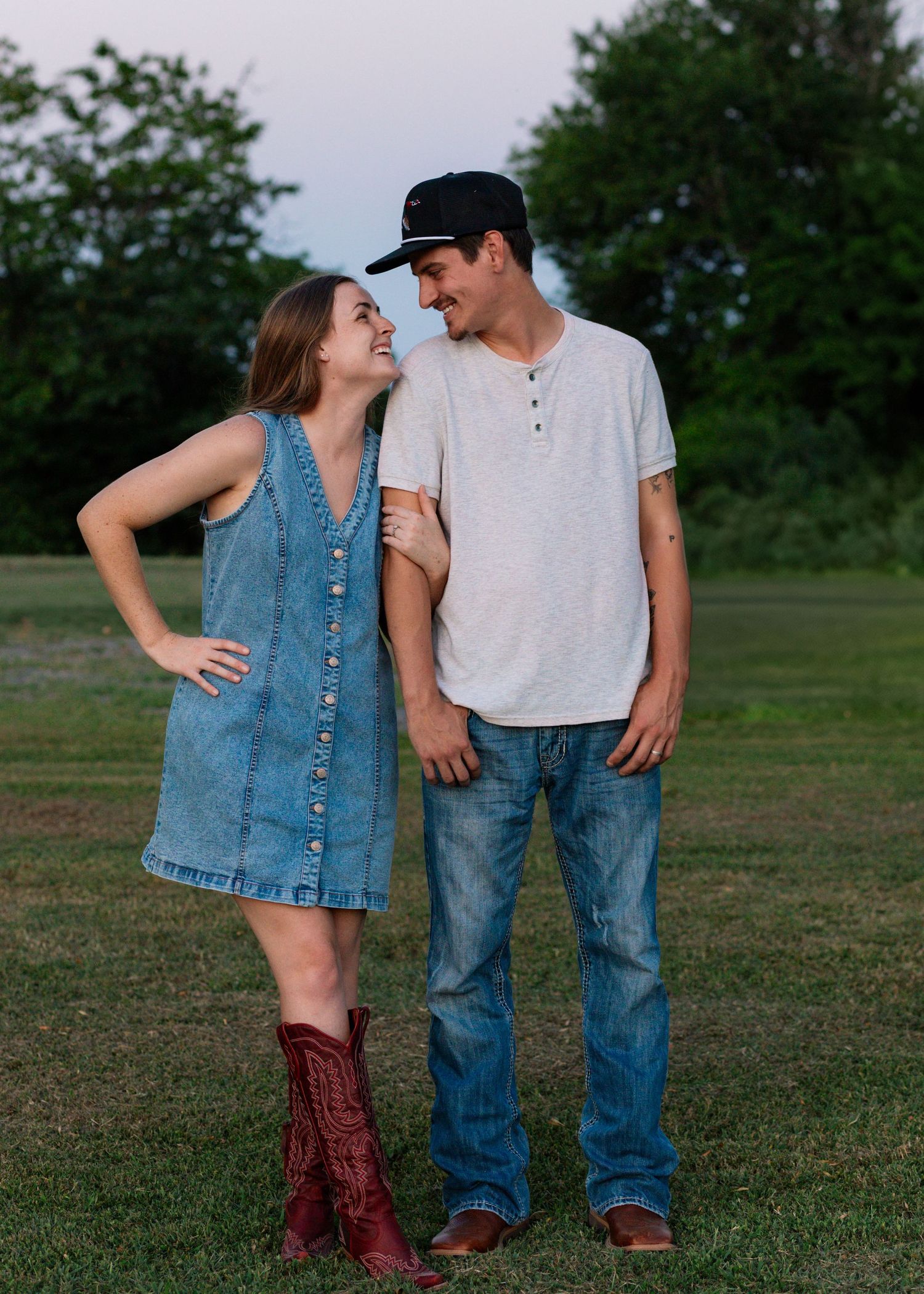 McAlester, OK couples session with field, tractor, and sunset by Edmond & OKC photographer Taylor Maze, natural light lifestyle portraits.