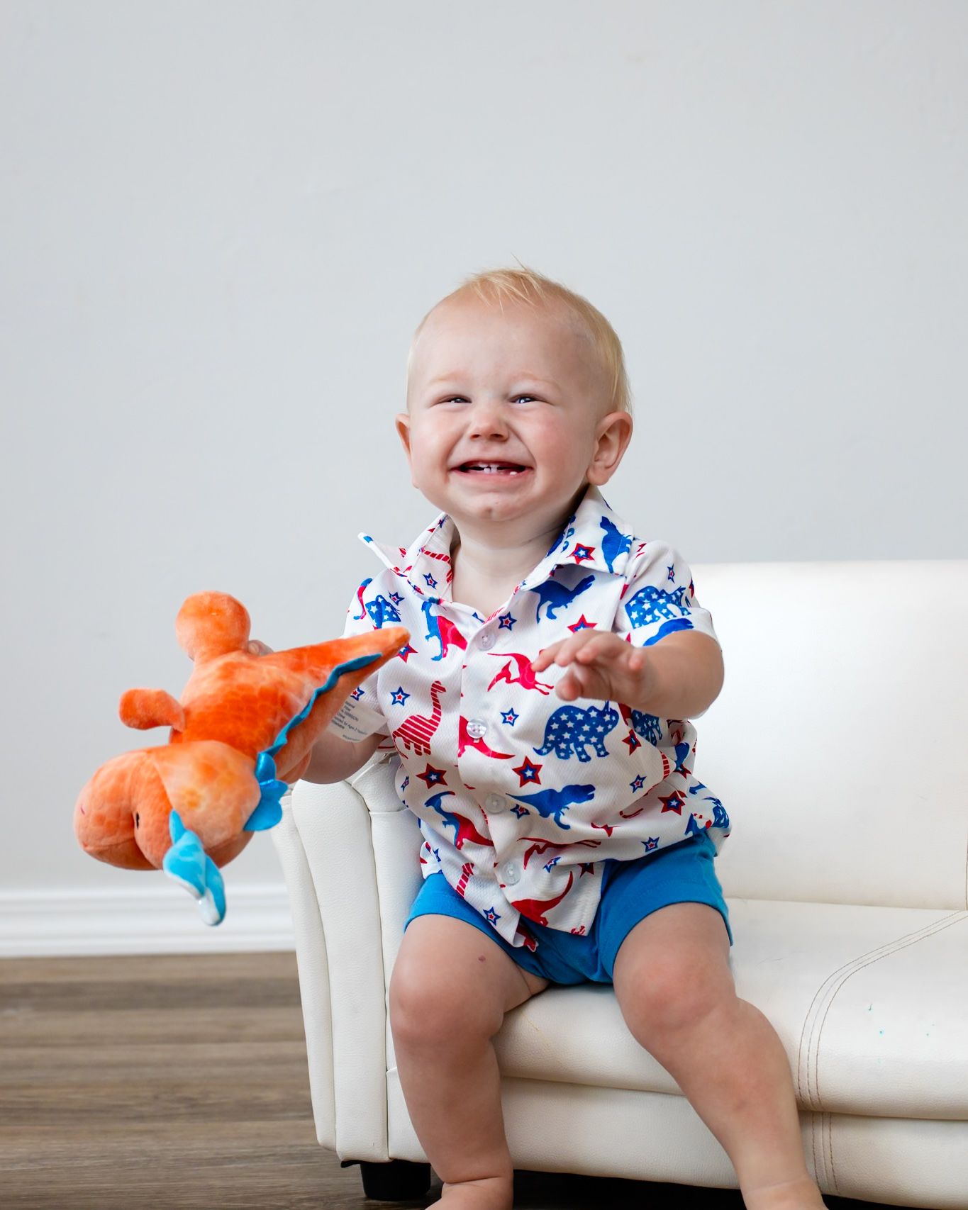 Indoor little boy session with dinosaur setup in Guthrie, OK by Taylor Maze, Edmond & OKC photographer, natural light, lifestyle portraits.