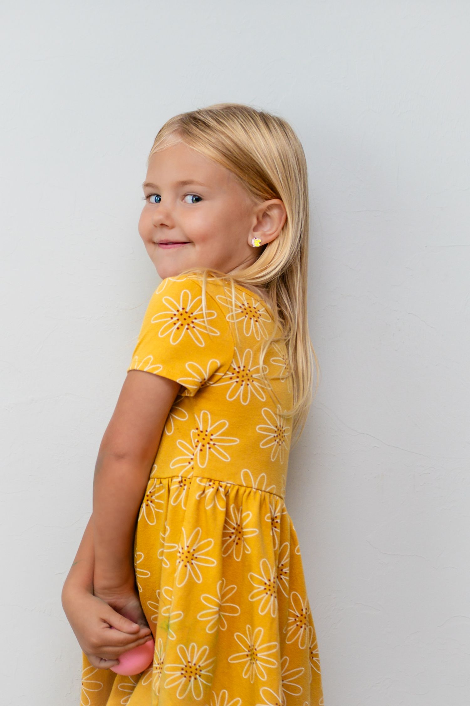 Indoor little girl session in yellow outfit in Guthrie, OK by Taylor Maze, Edmond & OKC photographer, natural light, true-to-color portraits