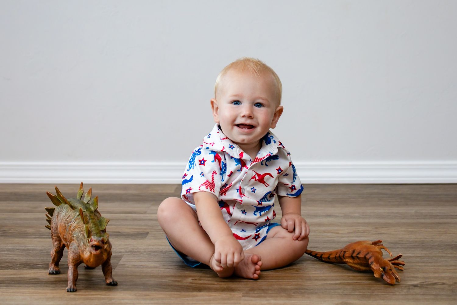 Indoor little boy session with dinosaur setup in Guthrie, OK by Taylor Maze, Edmond & OKC photographer, natural light, lifestyle portraits.