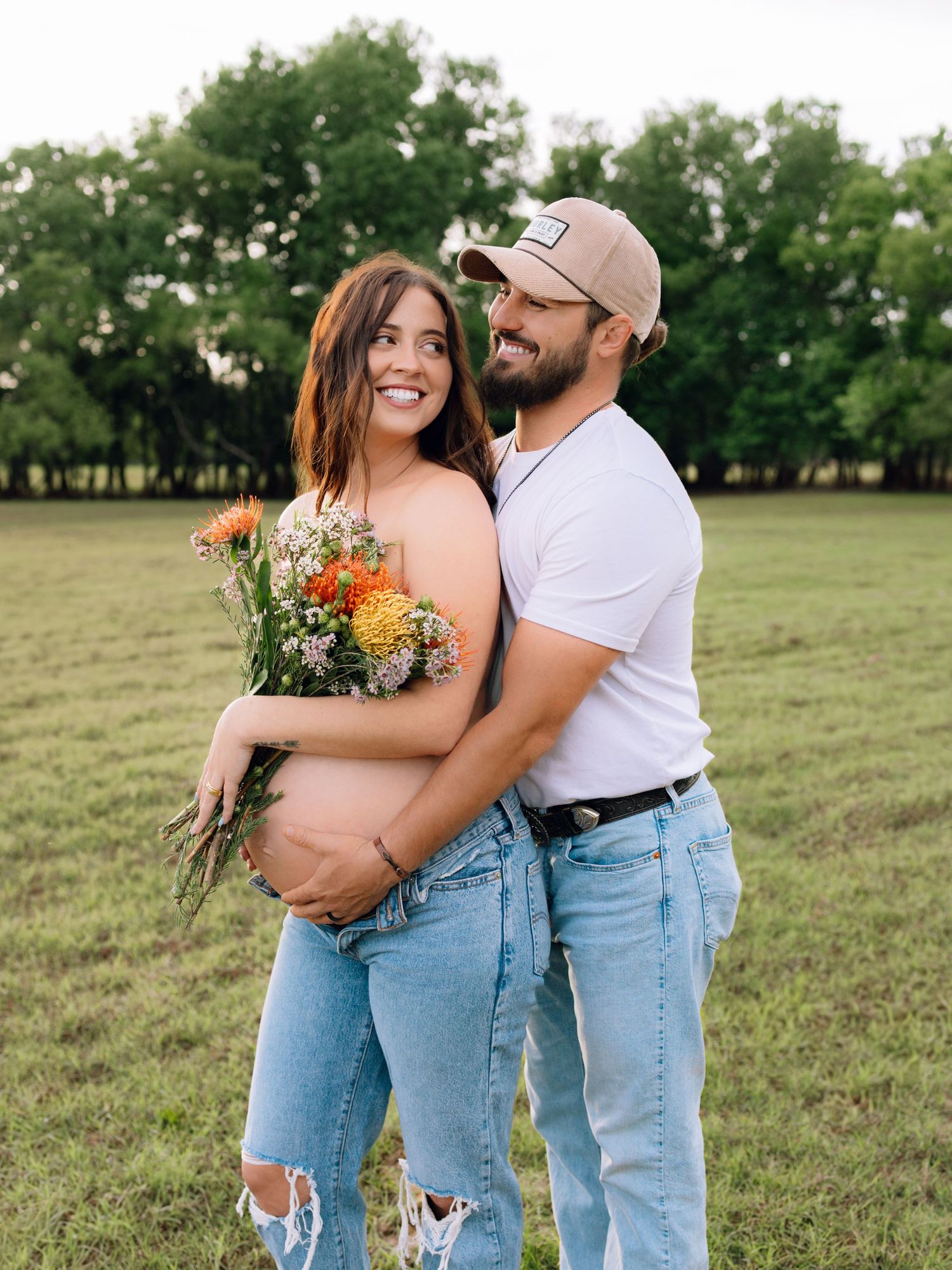 Edmond, OK maternity session in field at golden hour with flower shirt by Taylor Maze, Edmond & OKC photographer, natural light portraits.