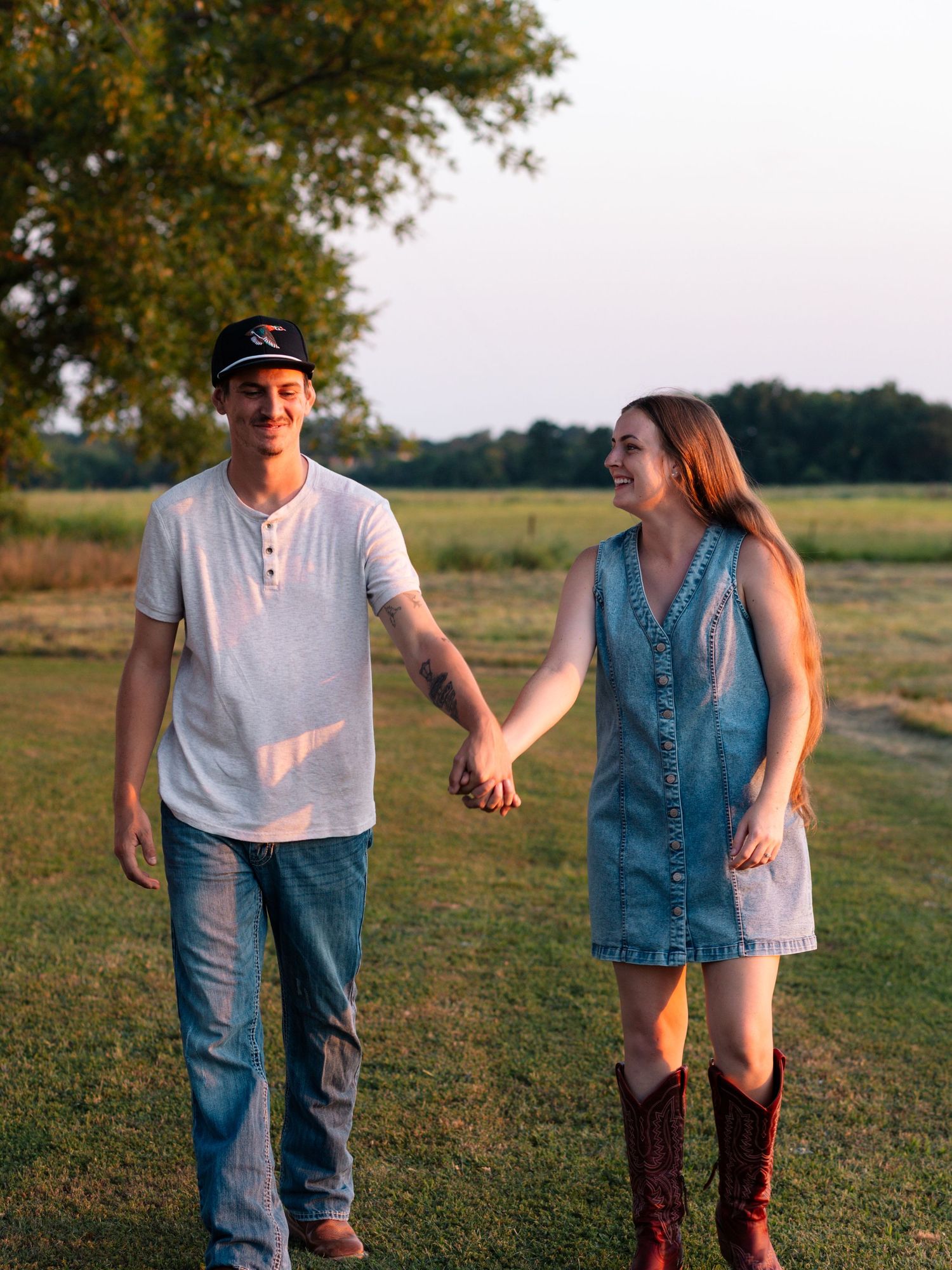 McAlester, OK couples session with field, tractor, and sunset by Edmond & OKC photographer Taylor Maze, natural light lifestyle portraits.