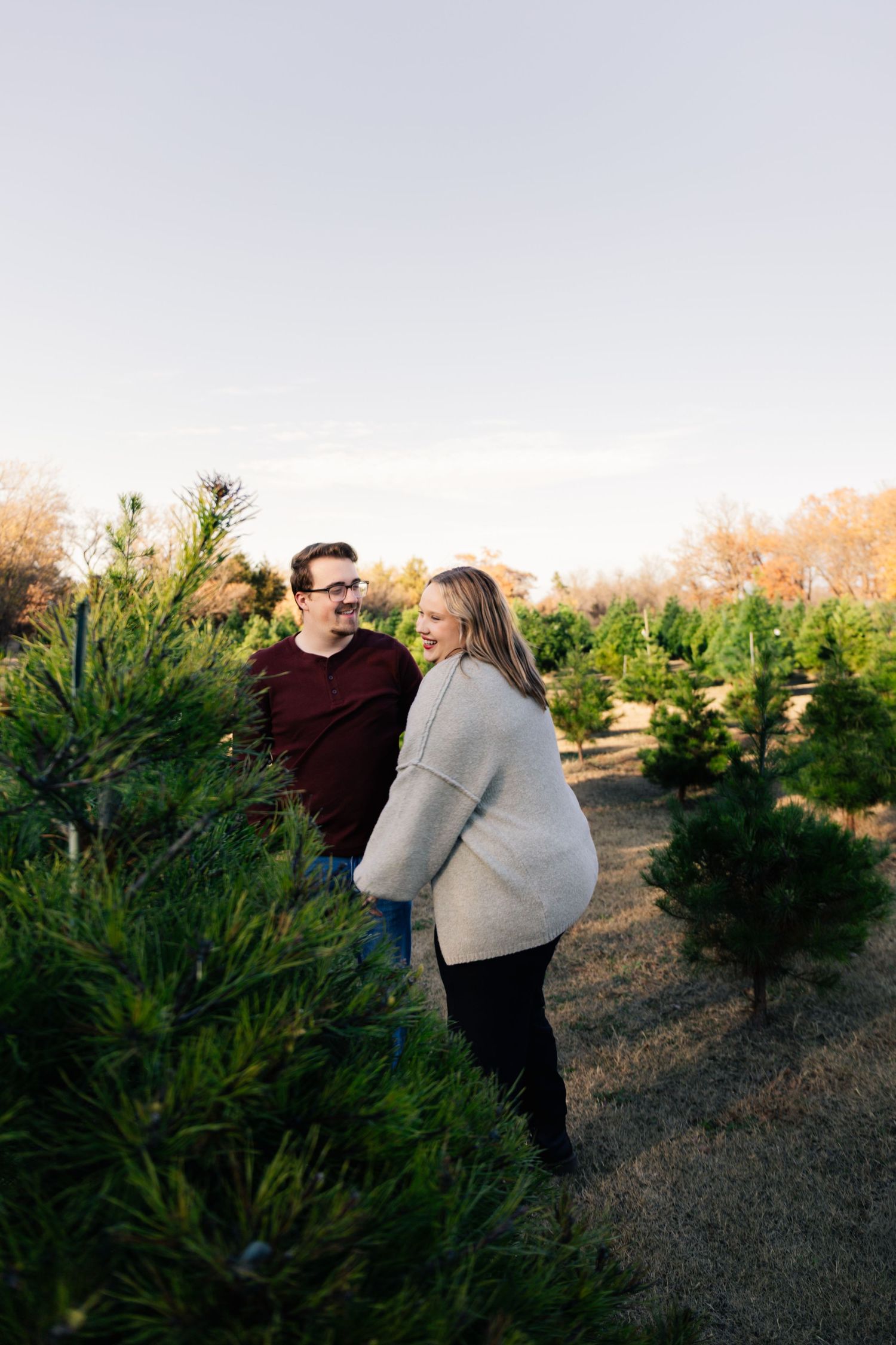 Norman, OK couples photoshoot at Christmas tree farm by Edmond & OKC photographer Taylor Maze, natural light, true-to-color portraits.
